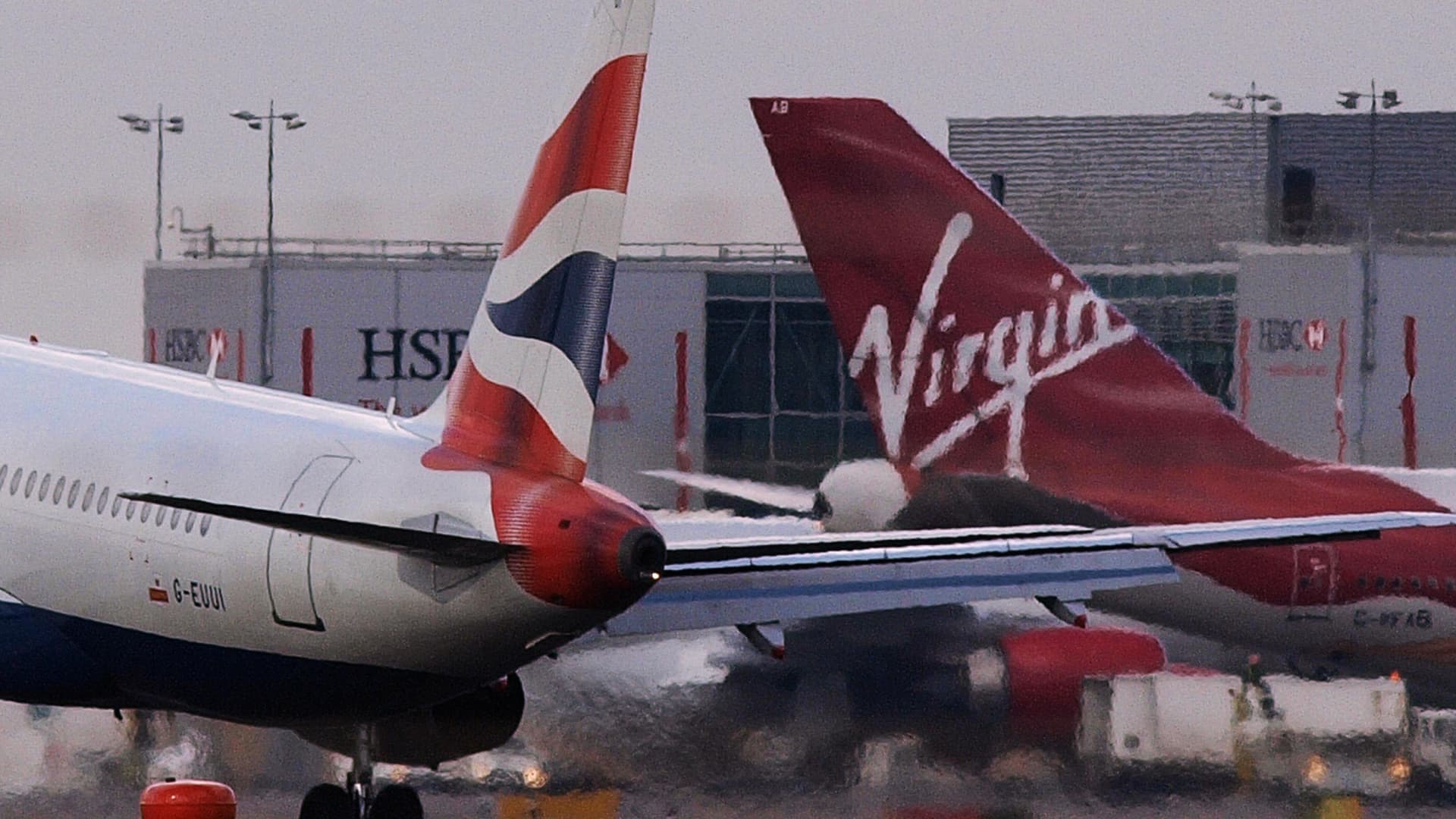 A British Airways plane and a Virgin Atlantic plane are pictured at London's Heathrow Airport.