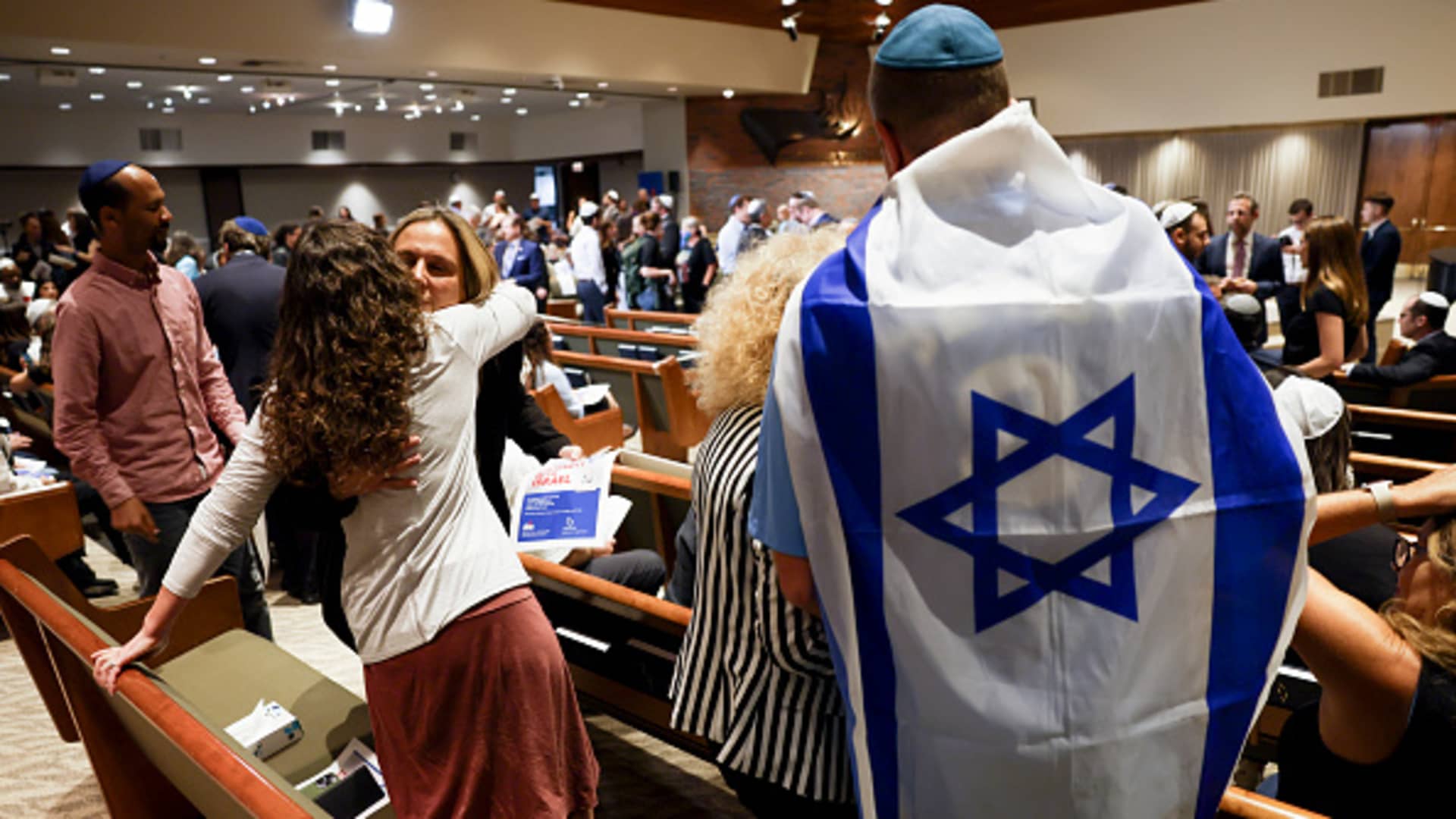 Mourners hug before a Vigil for Israel at Stephen Wise Temple in Los Angeles for victims of Saturday's Hamas attack against Israel, which has claimed more than 600 lives, Oct. 8, 2023.