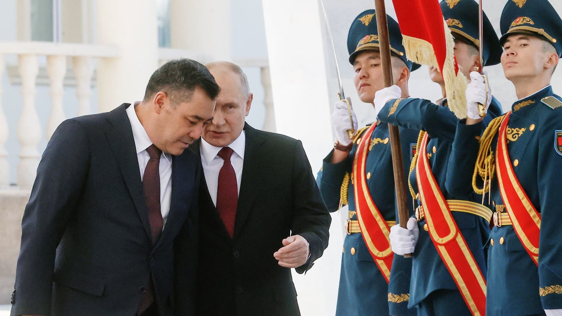 This pool photograph distributed by Russian state owned agency Sputnik shows Russia's President Vladimir Putin and his Kyrgyz counterpart Sadyr Japarov attending a welcoming ceremony prior to their talks in Bishkek on October 12, 2023.