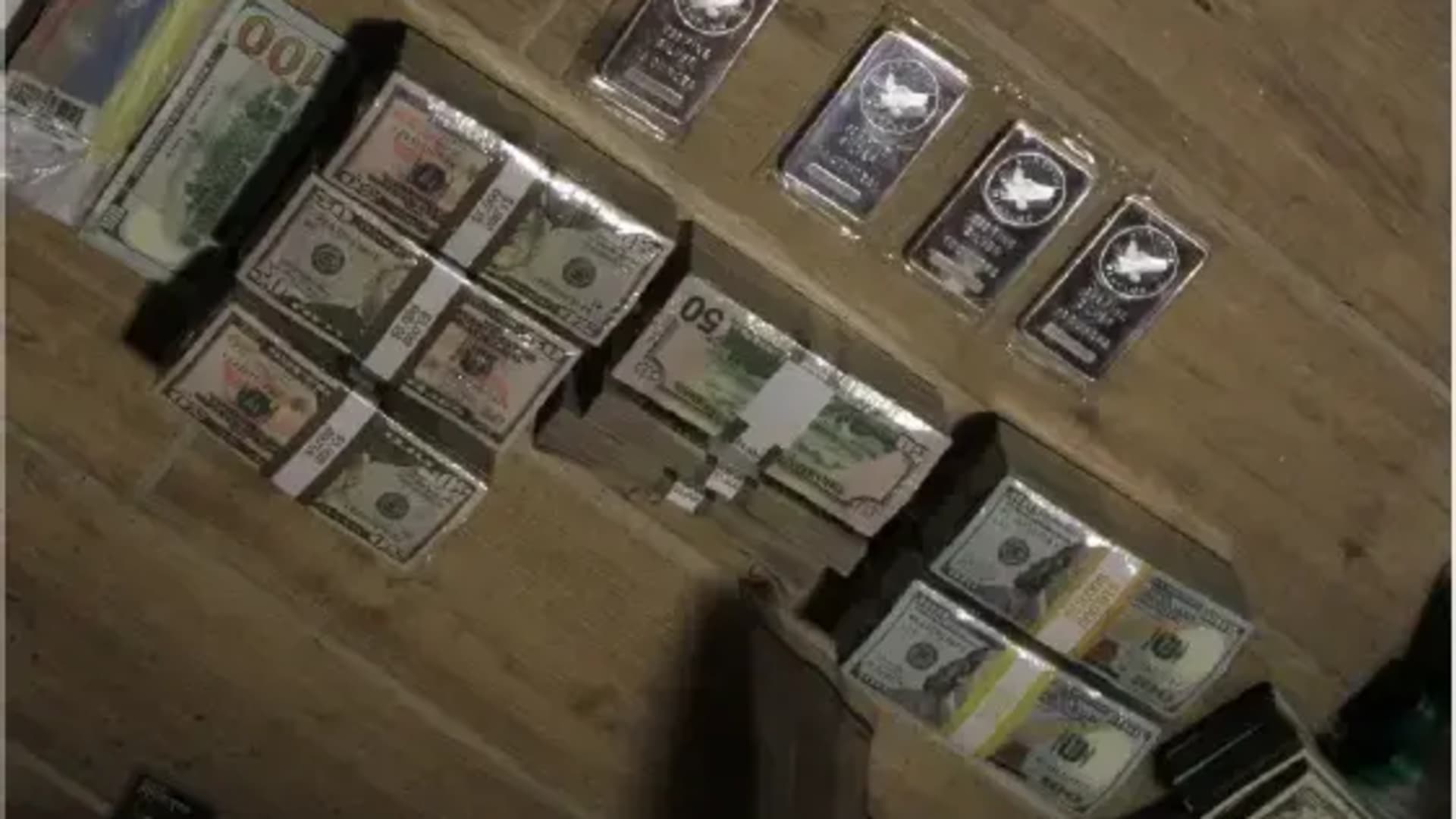 Physical bitcoin and cash investigators found during the search warrant. 