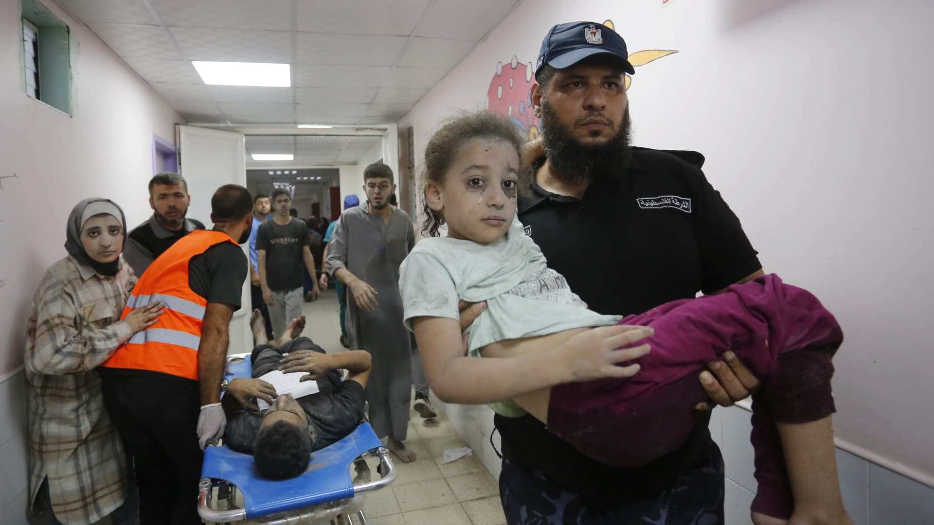 (EDITORS NOTE: Image depicts graphic content) Injured Palestinians including children are brought to hospital after Israeli airstrike in Deir-Al-Balah, Gaza on October 14, 2023.