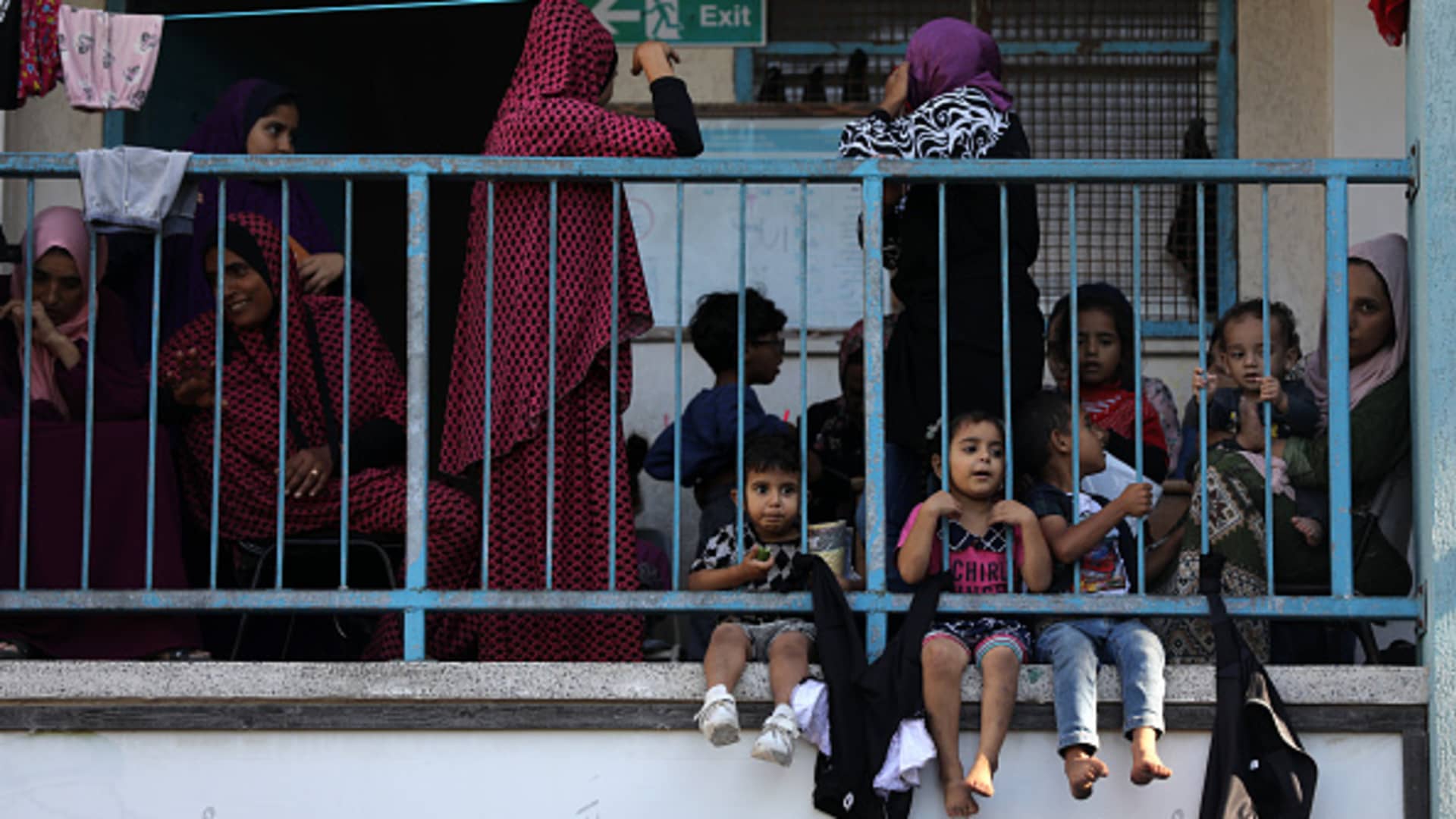 Internally displaced Palestinians take refuge in a United Nations school, in Deir al-Balah, central Gaza Strip on October 15, 2023.