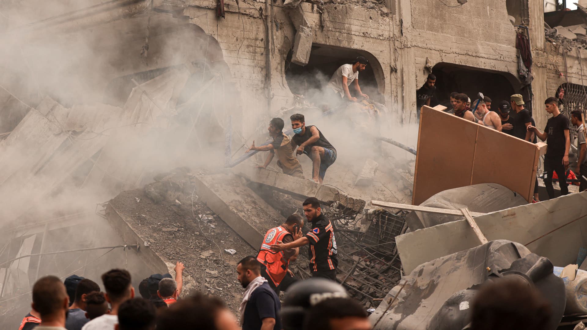 Palestinians searching for survivors after an Israeli airstrike on the refugee camp of Jabalia in the Gaza Strip on October 9, 2023.