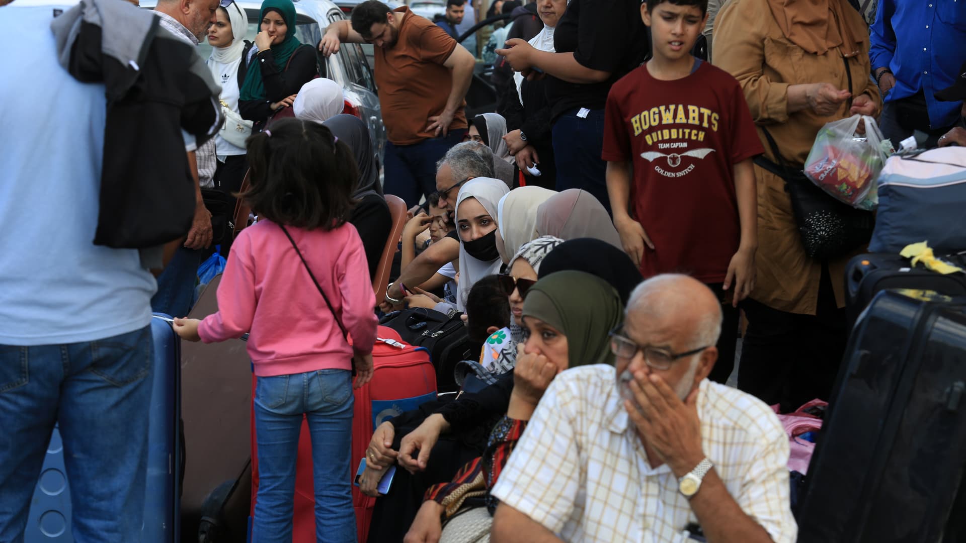 Gazans with foreign passports wait at the Rafah Border Gate to cross into Egypt as Israel's attacks on Gaza continue on the eighth day in Rafah, Gaza on Oct. 14, 2023.