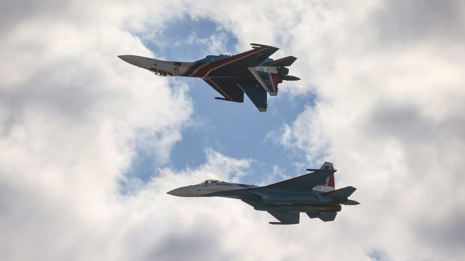 The Russian Knights aerobatic unit fly Sukhoi Su-35S fighter jets during a display at the MAKS International Aviation and Space Salon at Zhukovsky International Airport in Moscow, Russia, on July 22, 2021.