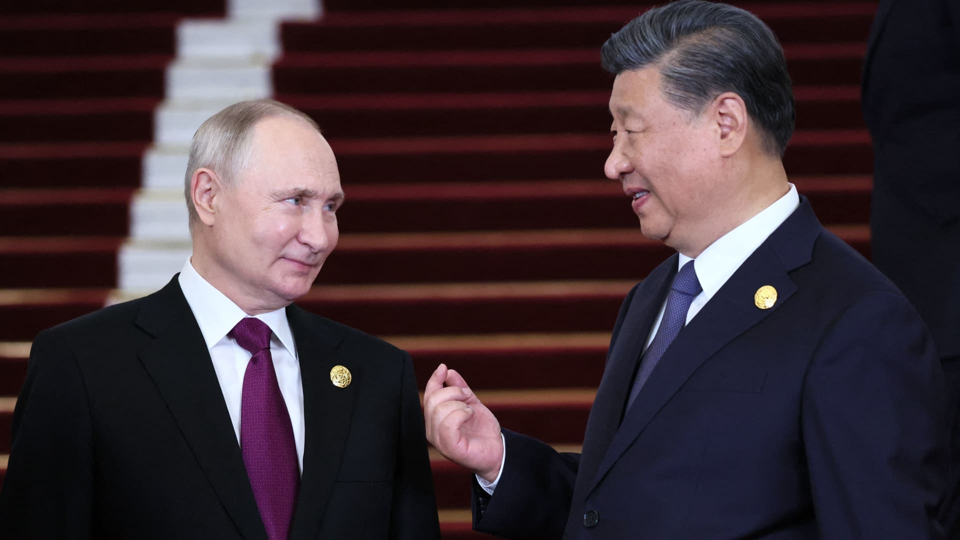A pool photograph distributed by Russian state owned agency Sputnik showing Russia's President Vladimir Putin and Chinese President Xi Jinping during a welcoming ceremony at the Third Belt and Road Forum in Beijing on October 17, 2023.