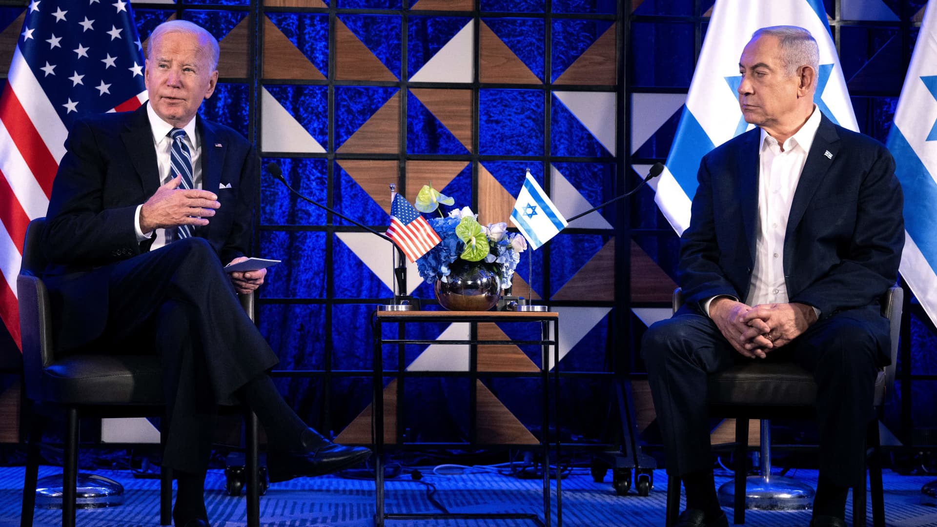 US President Joe Biden (L) speaks as Israel's Prime Minister Benjamin Netanyahu listens on prior to their meeting in Tel Aviv on October 18, 2023, amid the ongoing battles between Israel and the Palestinian group Hamas.