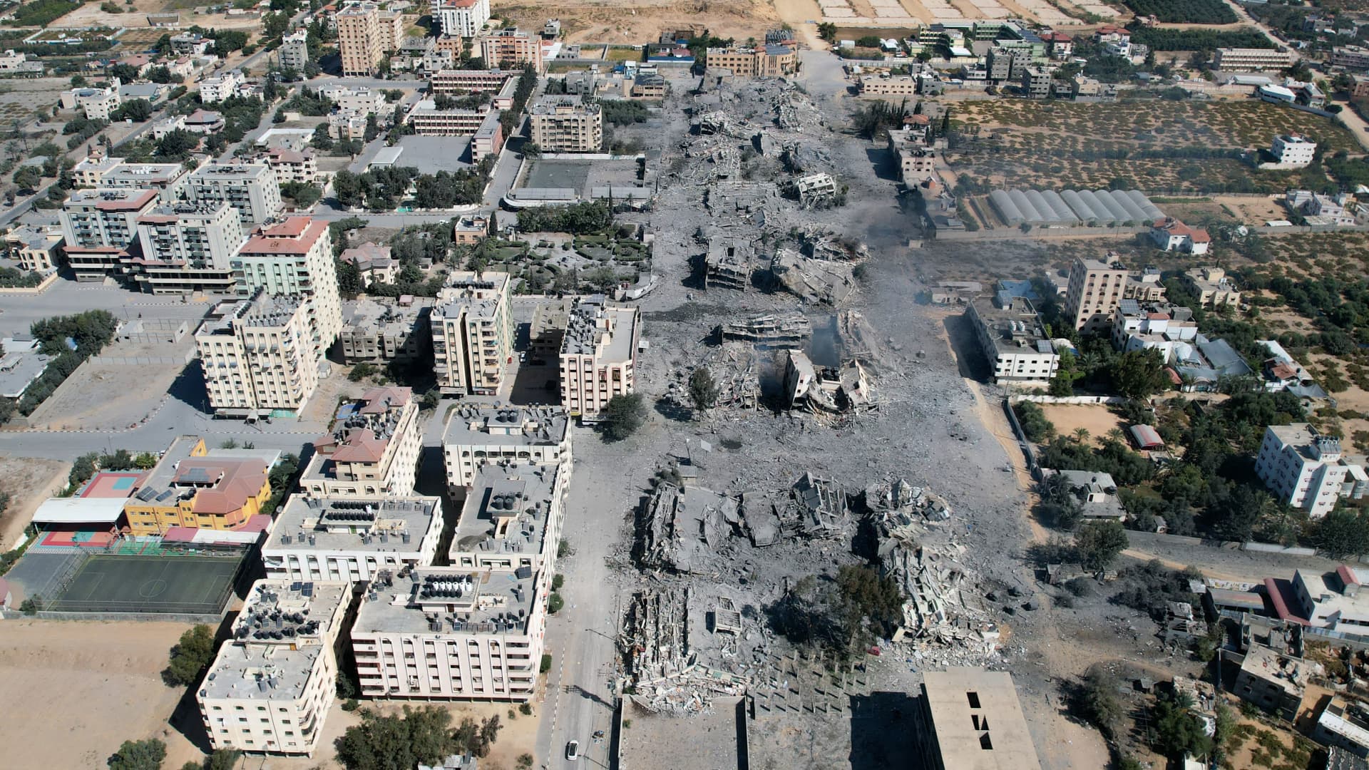 An arial view shows destoyed buildings in al-Zahra city south of Gaza City on October 20, 2023 following Israeli bombardment overnight amid ongoing battles between Israel and the Palestinian group Hamas. 