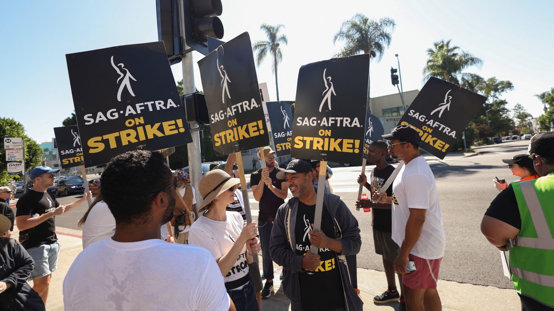 SAG-AFTRA members walk the picket line on the 100th day of their ongoing strike outside Paramount Studios in Los Angeles, California, October 20, 2023.