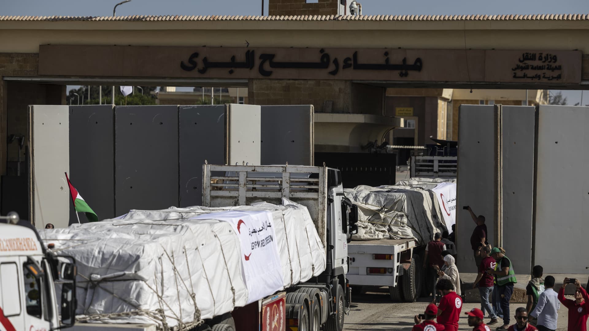 Aid convoy trucks cross the Rafah border from the Egyptian side on October 21, 2023 in North Sinai, Egypt.
