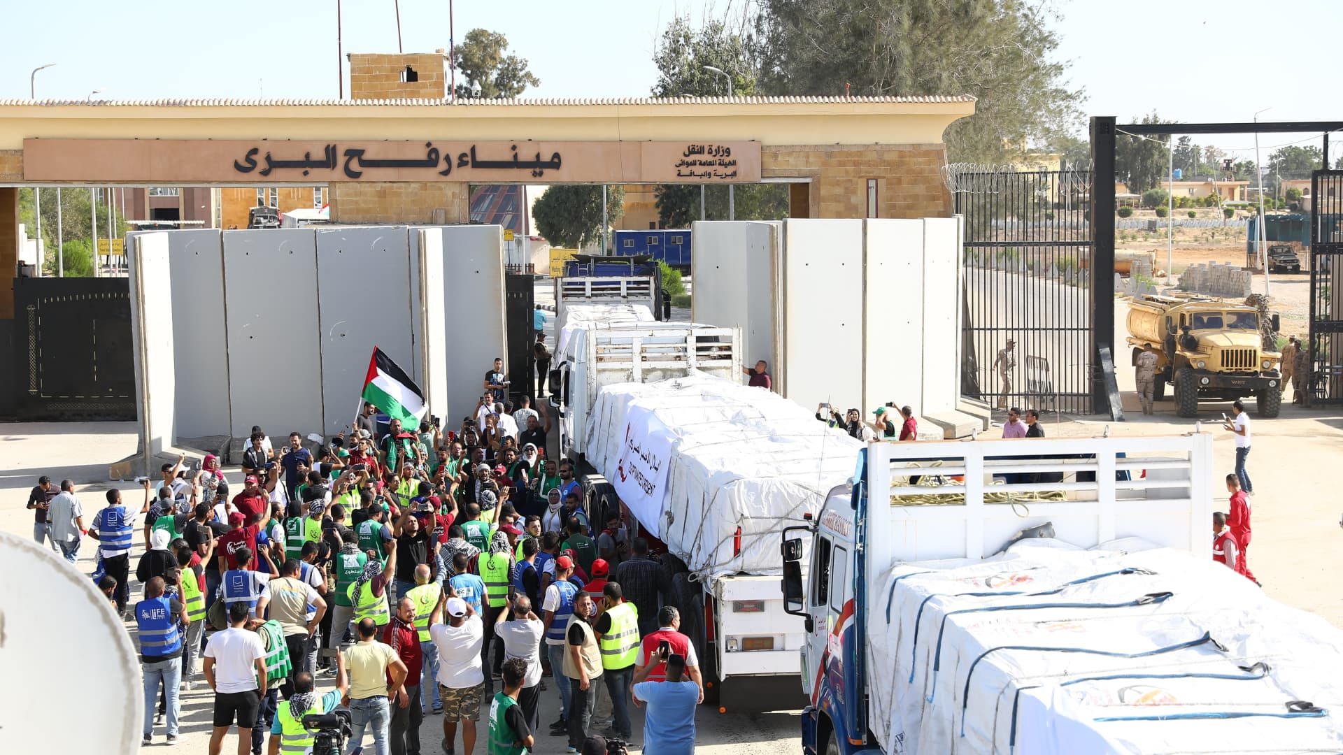 The first convoy of relief trucks begins to enter the Gaza Strip from the Egyptian side of the Rafah crossing, in Rafah, Gaza, on Oct. 21, 2023.