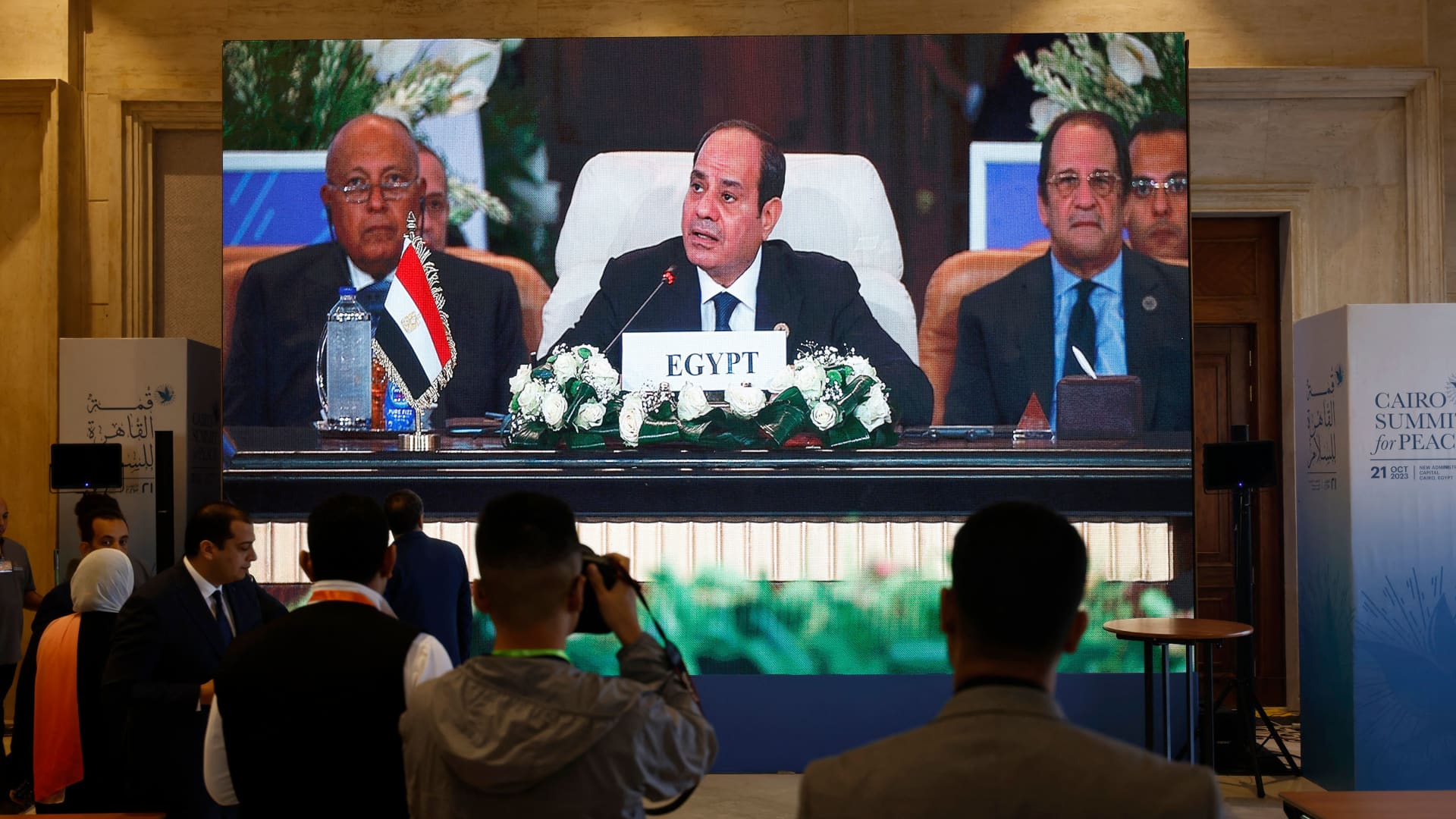 Seen on a large screen the Egyptian President Abdel-Fattah al-Sisi opens the International Peace Summit in Cairo on October 21, 2023, amid the ongoing battles between Israel and the Palestinian group Hamas.