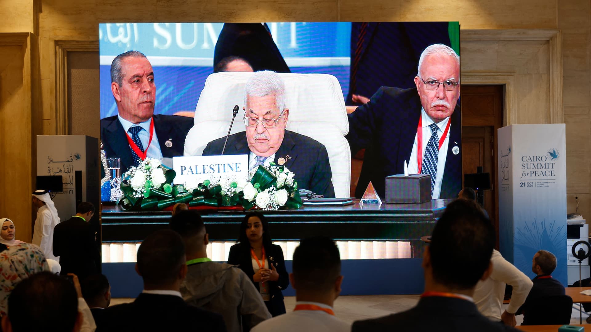 Seen on a large screen, Palestinian President Mahmoud Abbas attends the International Peace Summit hosted by the Egyptian president in Cairo on Oct. 21, 2023.