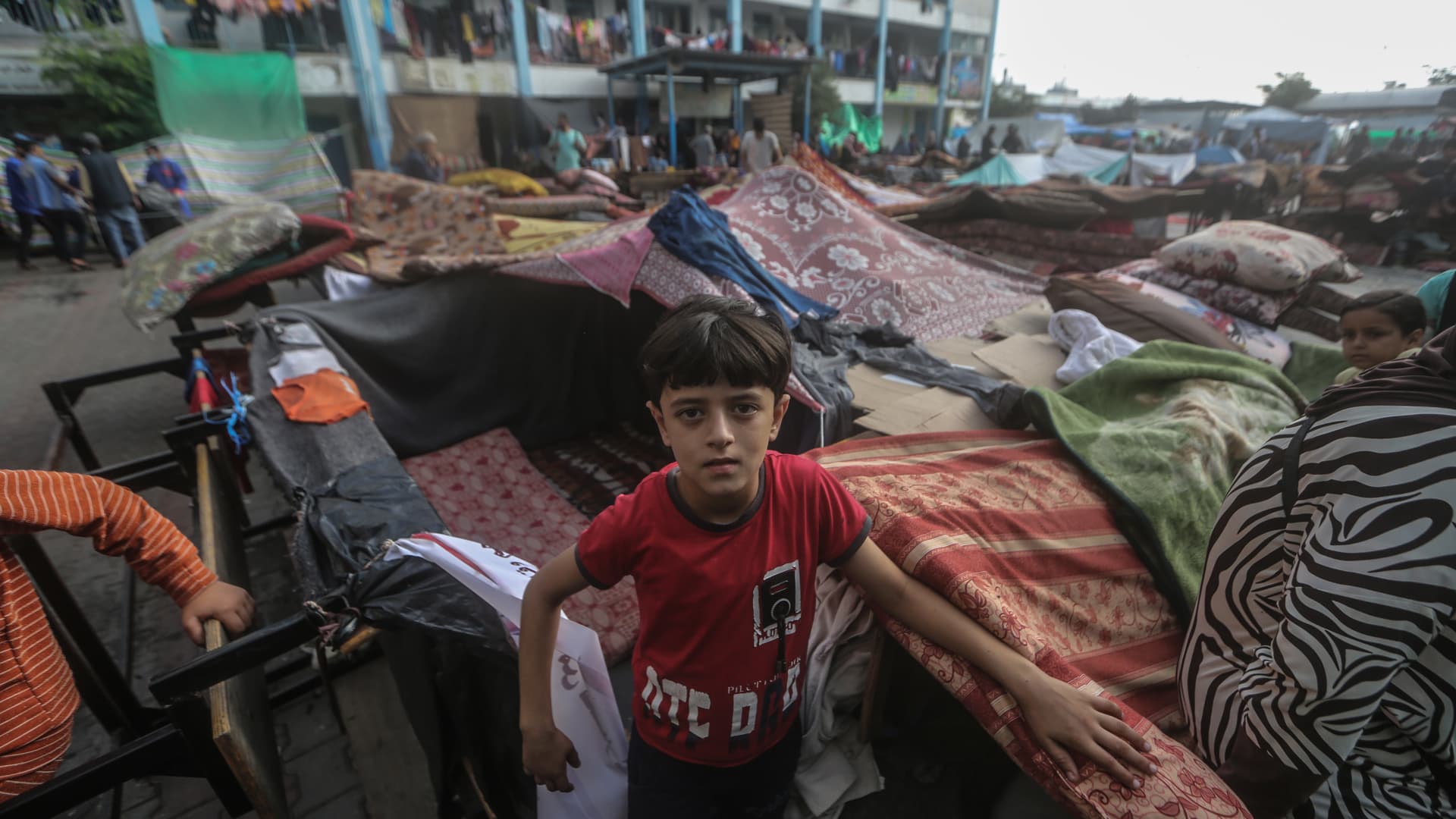 Palestinians take shelter in a school run by the United Nations Relief and Works Agency for Palestine Refugees in the Near East (UNRWA) as fighting continues between the Palestinian militant group Hamas and Israel.