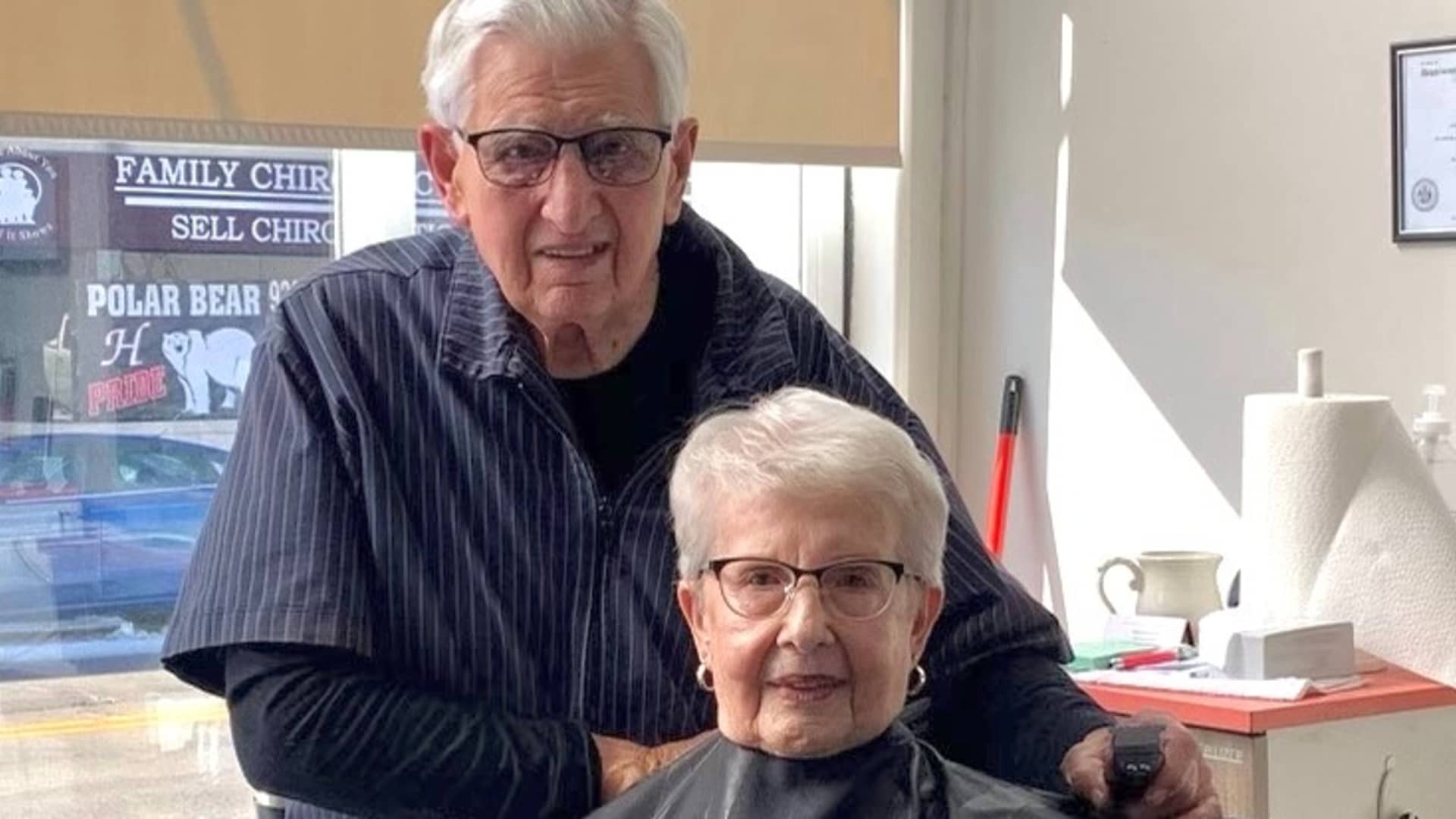 Bob Rohloff cuts his wife Marian's hair at his new barbershop.