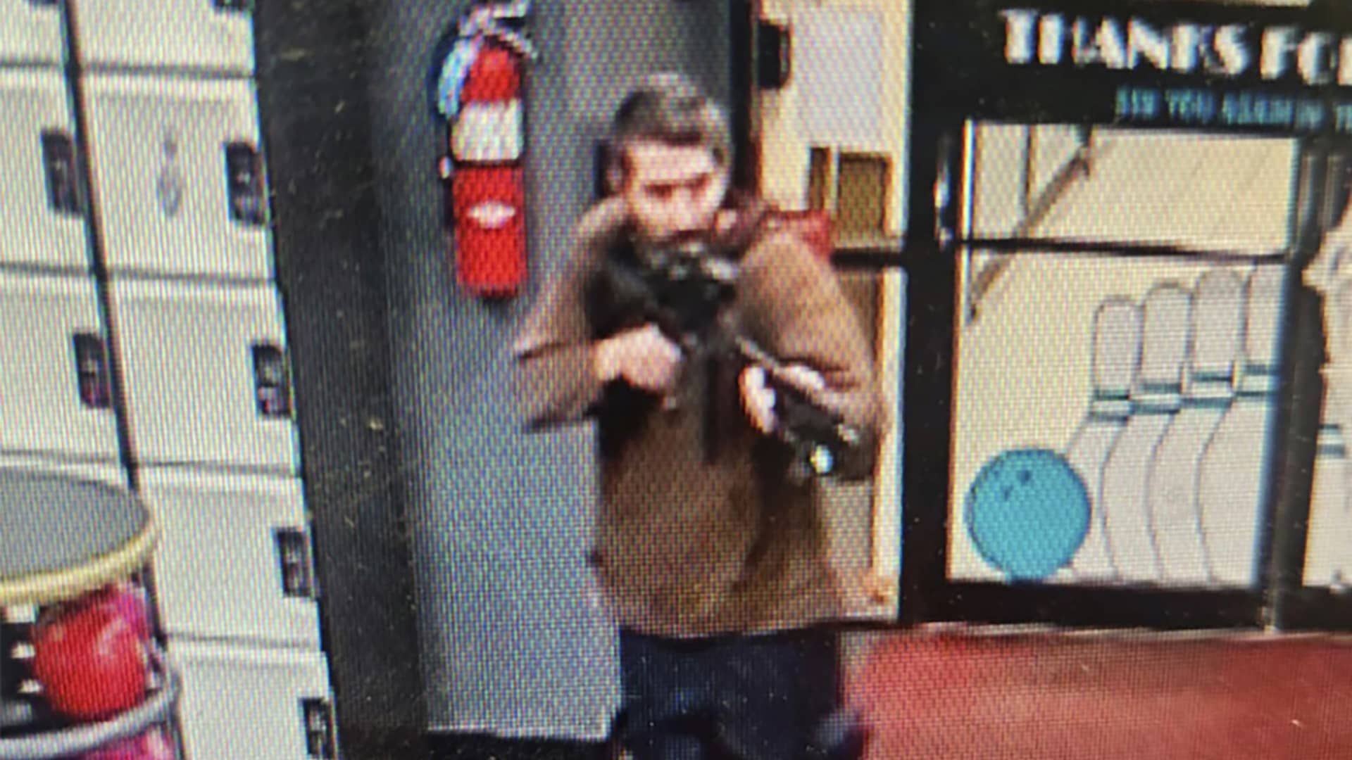 In this image from video released by the Androscoggin County Sheriff's Office, a gunman enters Just-In-Time Recreation in Lewiston, Maine, on Oct. 25, 2023.