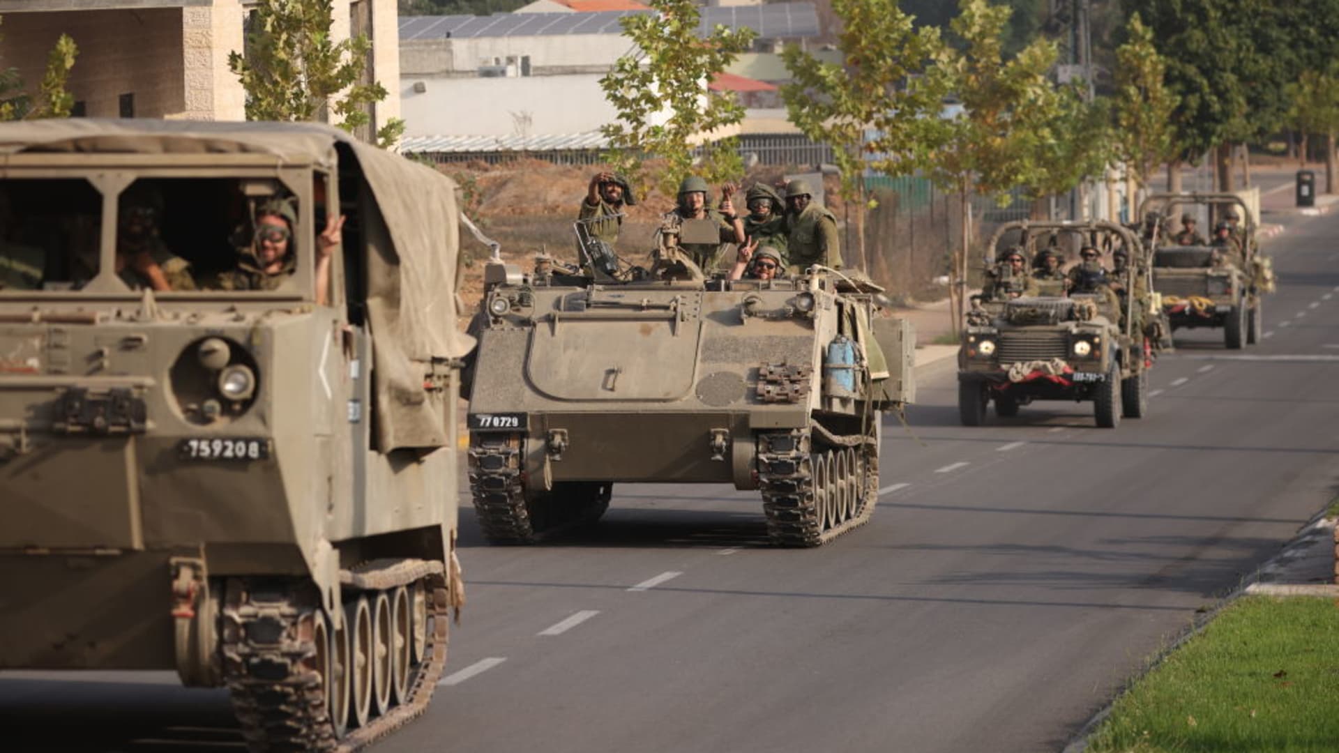 Israeli tanks and troops move near the border with Gaza on October 28, 2023 in Sderot, Israel. 