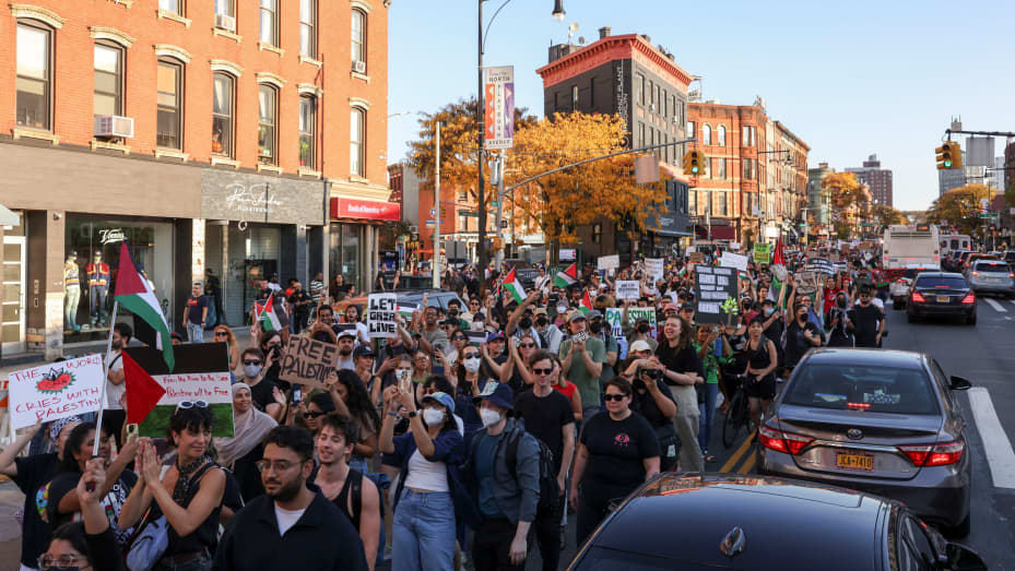 People gather as Pro-Palestinian protesters attend "Flood Brooklyn for Gaza" demonstration, as the conflict between Israel and the Palestinian Islamist group Hamas continues, in New York, U.S., October 28, 2023. REUTERS/Caitlin Ochs