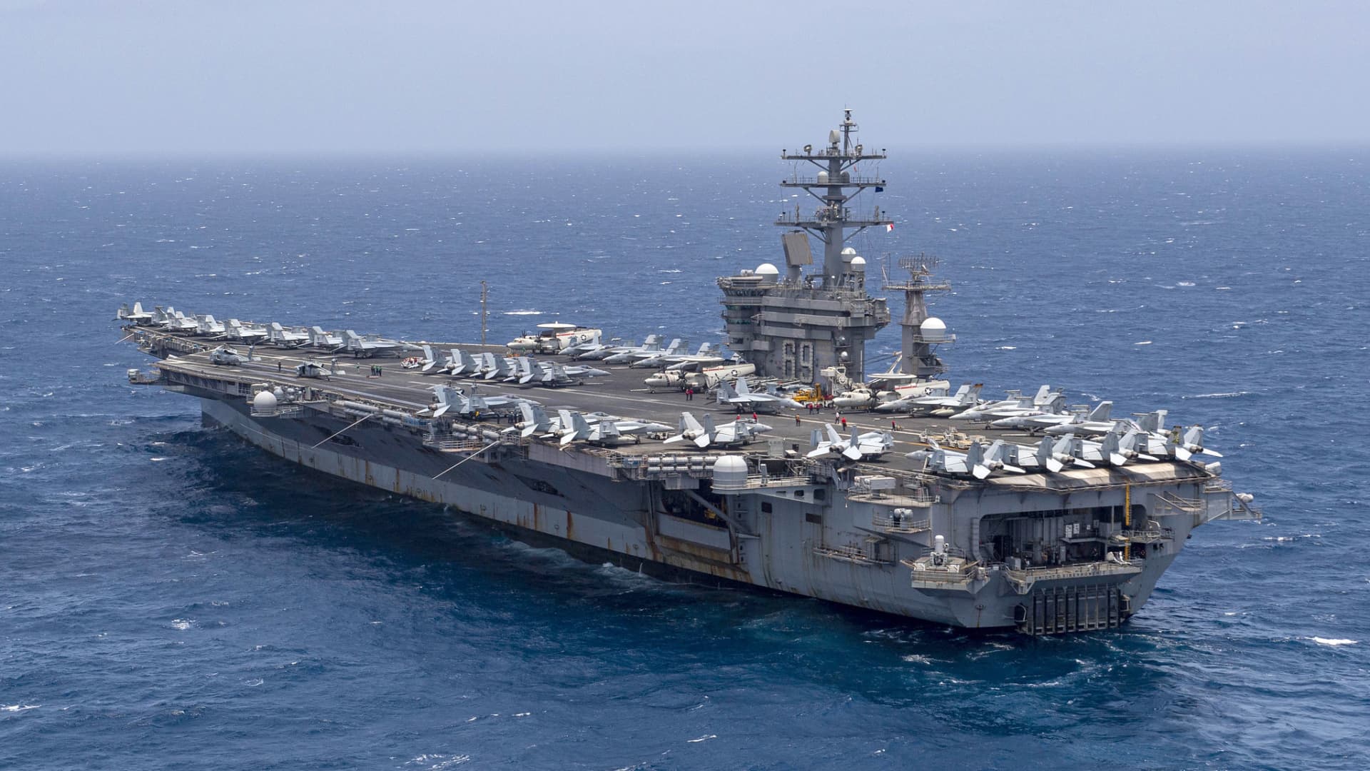 Onboard a U.S. aircraft carrier, a cat-and-mouse game with Houthi forces plays out