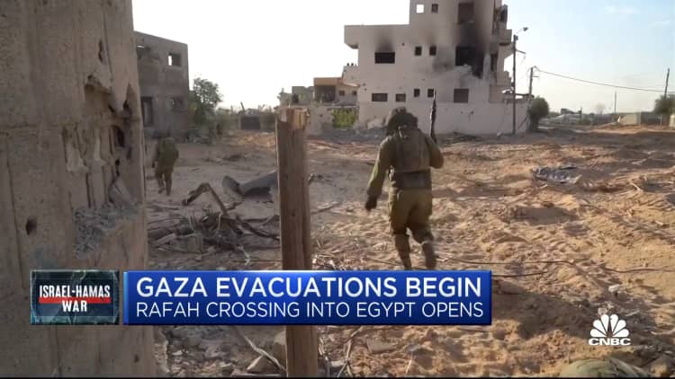 Israel-Hamas conflict: Evacuations begin in Gaza as Rafah border crossing into Egypt opens