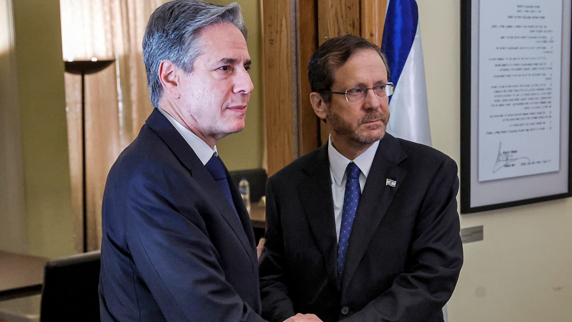 US Secretary of State Antony Blinken (L) shakes hands with Israeli President Isaac Herzog during their meeting at the Ben-Gurion House on the Kirya military base in Tel Aviv on November 3, 3023 during his visit to Israel amid the ongoing conflict between Israel and the Palestinian Islamist group Hamas. 