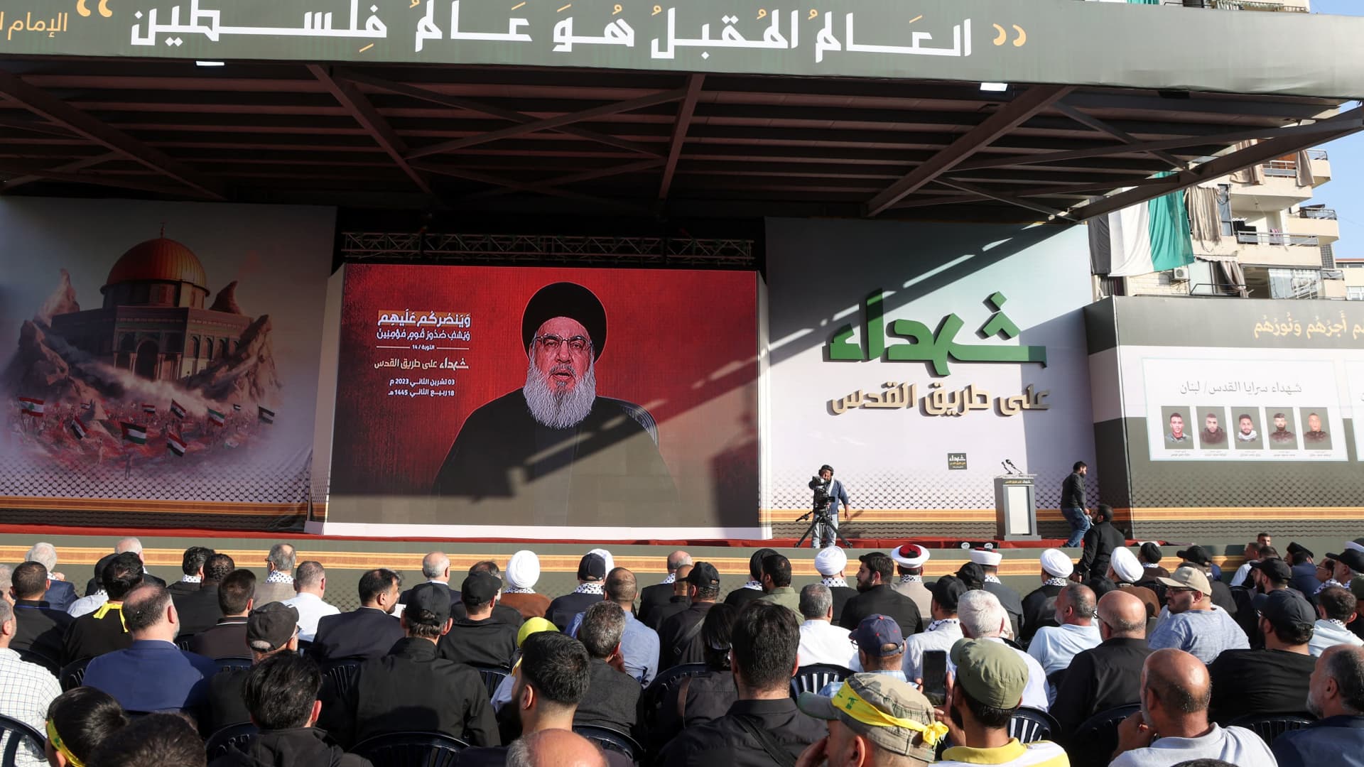 Lebanon's Hezbollah leader Sayyed Hassan Nasrallah appears on a screen as he addresses his supporters during a ceremony to honour fighters killed in the recent escalation with Israel, in Beirut's southern suburbs, Lebanon November 3, 2023. 