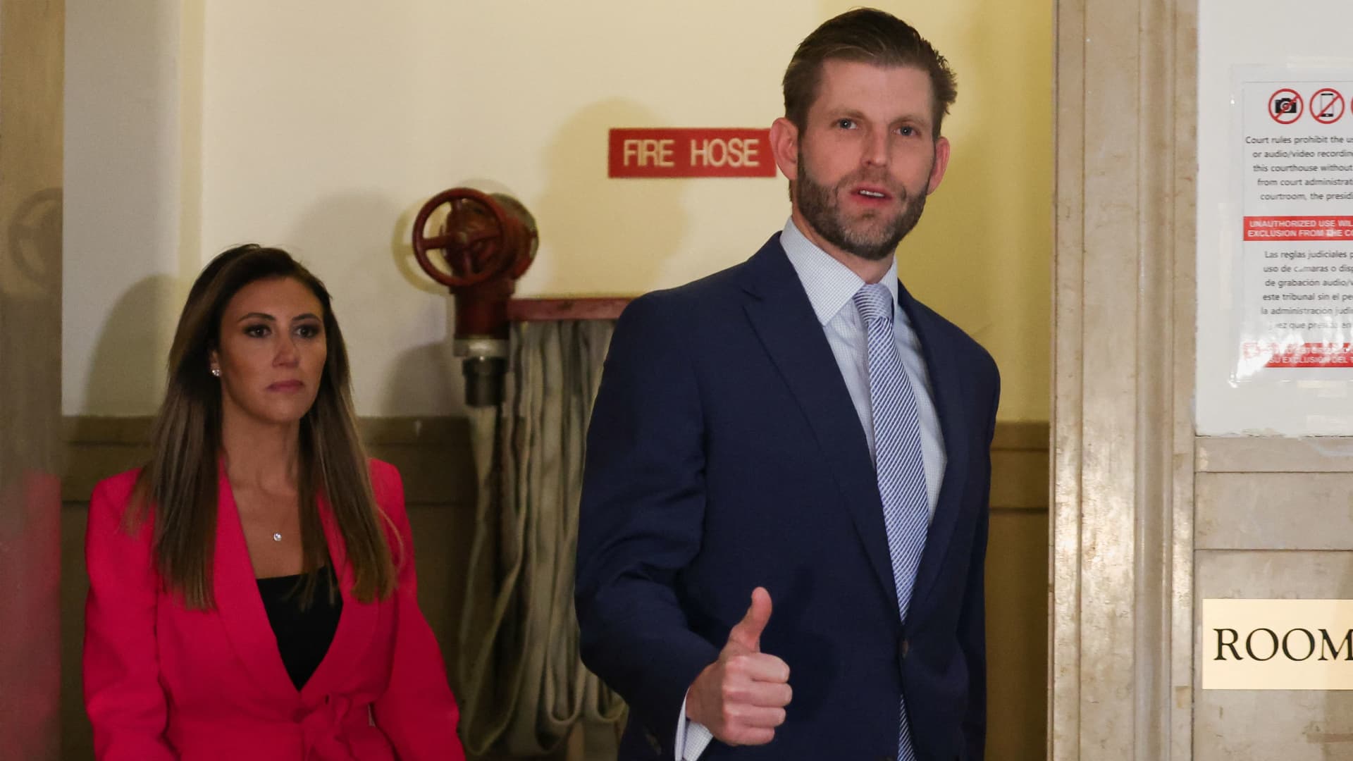 Former U.S. President Donald Trump's son and co-defendant, Eric Trump gestures as he walks outside the courtroom on the day of the Trump Organization civil fraud trial, in the New York State Supreme Court in the Manhattan borough of New York City U.S., November 3, 2023. 