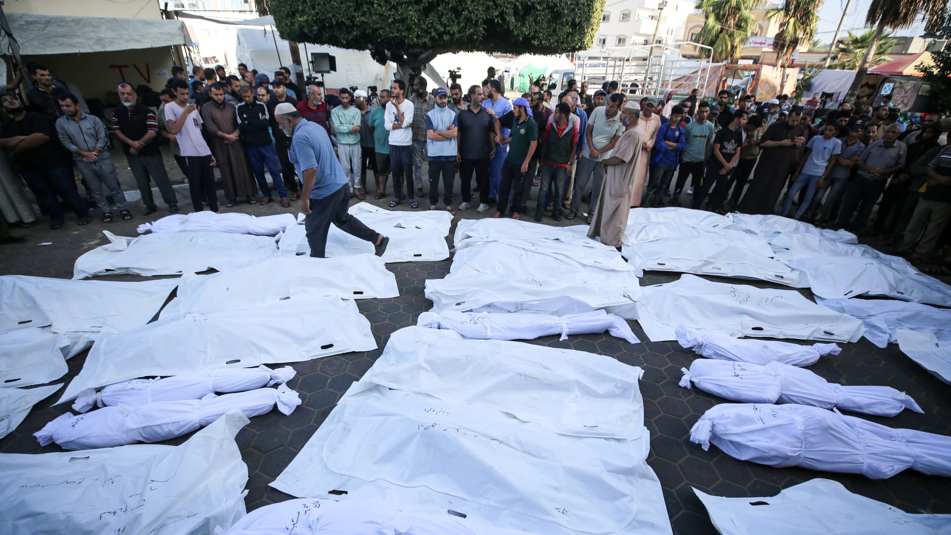 Palestinians gather as they mourn over the bodies of those killed in Israeli bombardment in Deir Balah in the central Gaza Strip, at the Shuhada Al-Aqsa hospital in the same city on November 6, 2023, amid the ongoing battles between Israel and the Palestinian group Hamas.