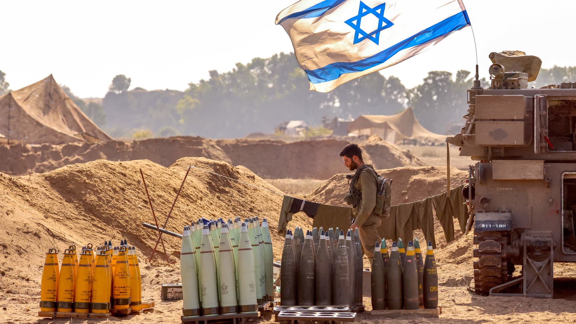 An Israeli soldier arranges artillery shells at a position near the border with the Gaza Strip in southern Israel on November 6, 2023 amid the ongoing battles between Israel and the Palestinian group Hamas in the Gaza Strip. 