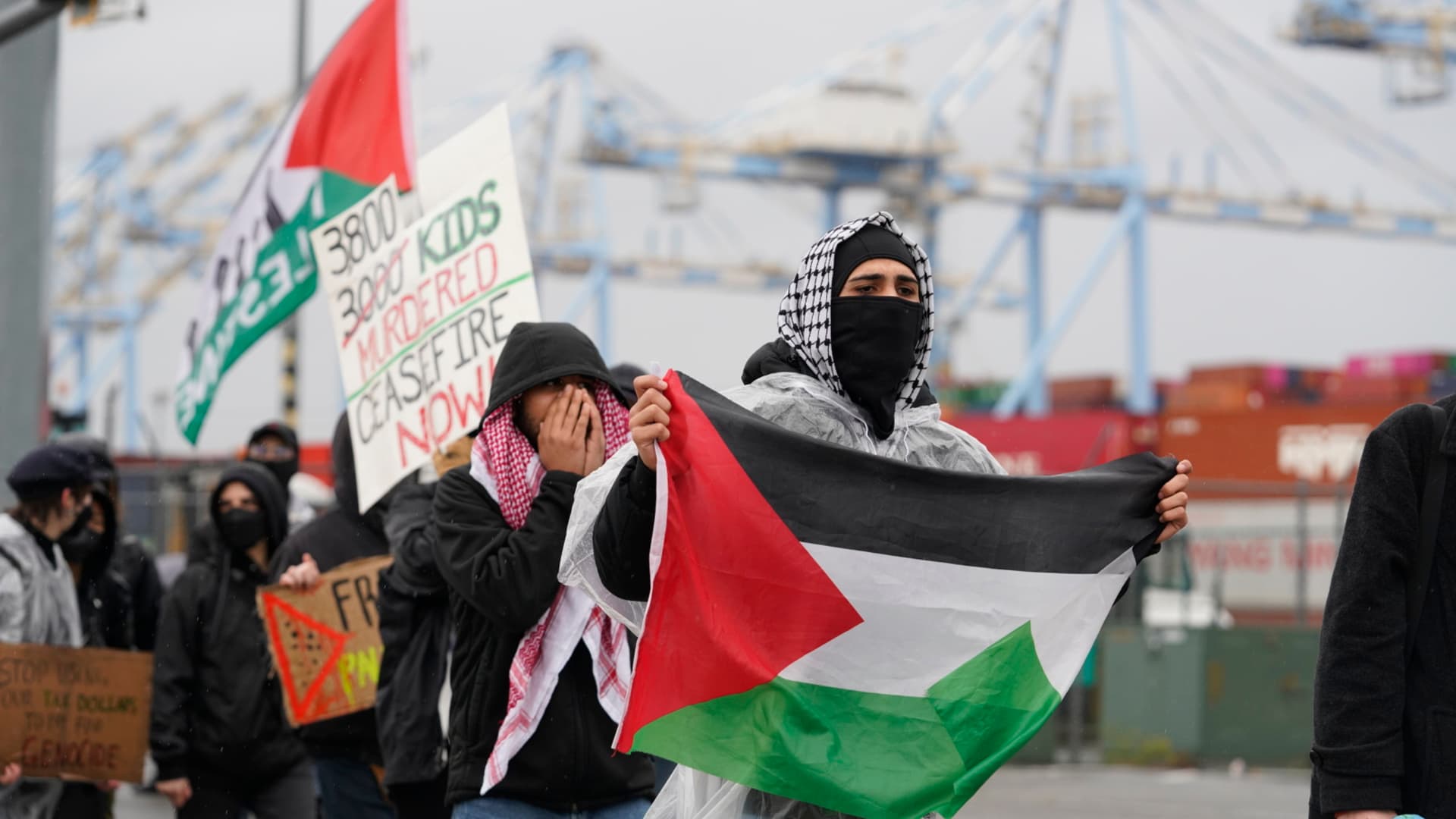 Pro-Palestinian protesters block access to an entry point at the Port of Tacoma in Tacoma, Washington, US, on Monday, Nov. 6, 2023. The protesters are demonstrating what they believe is a military supply ship that is docked at the port and bound for Israel, according to the Seattle Times. Photographer: M. Scott Brauer/Bloomberg via Getty Images