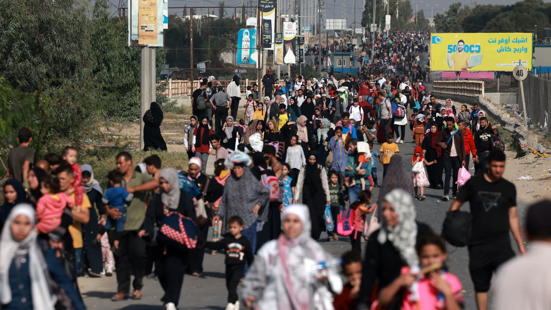 Palestinians fleeing Gaza City towards the southern areas walk on a road on November 8, 2023, amid the ongoing battles between Israel and the Palestinian Islamist group Hamas. 