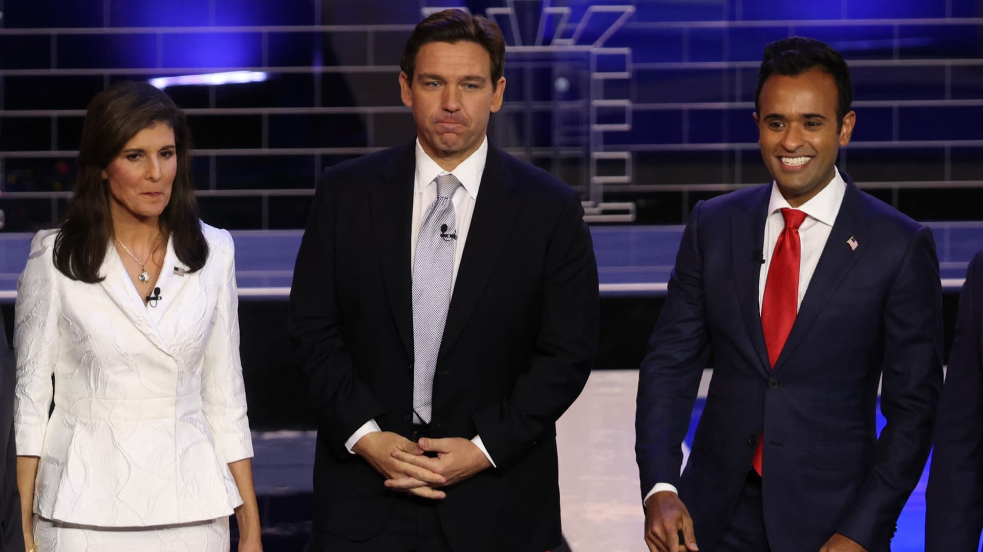 Former South Carolina Governor Nikki Haley, Florida Governor Ron DeSantis and former biotech executive Vivek Ramaswamy pose together onstage at the third Republican candidates' U.S. presidential debate of the 2024 U.S. presidential campaign hosted by NBC News at the Adrienne Arsht Center for the Performing Arts in Miami, Florida, U.S., November 8, 2023. 
