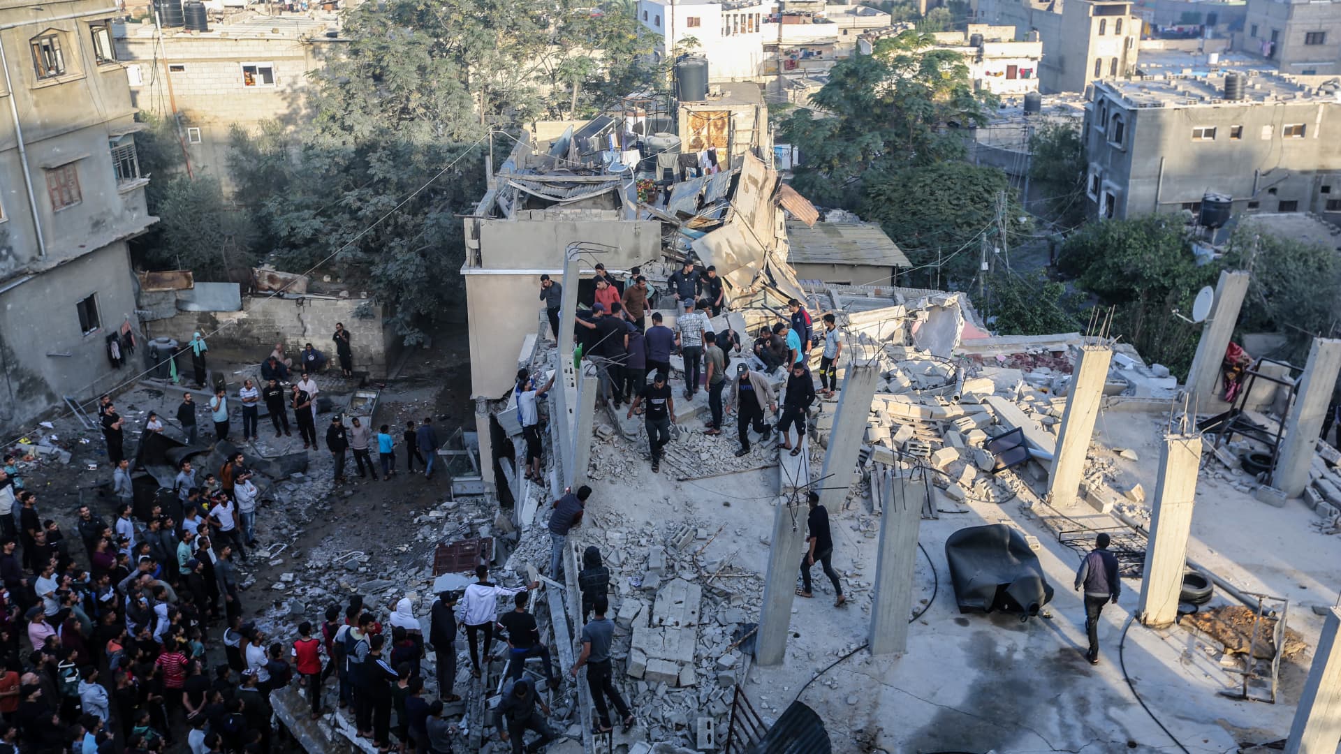 People search through buildings, destroyed during Israeli air raids in the southern Gaza Strip on Nov. 9, 2023 in Khan Yunis, Gaza. 