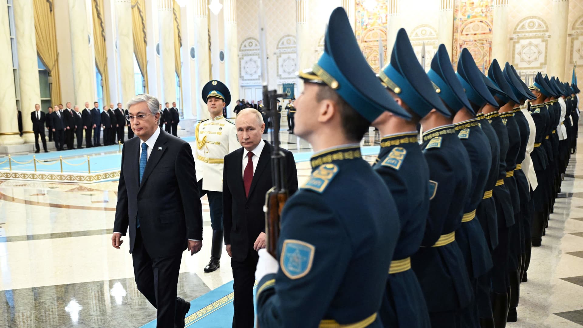 This pool photograph distributed by Russian state agency Sputnik shows Kazakhstan's President Kassym-Jomart Tokayev (L) and Russia's president Vladimir Putin (C) inspecting a guard of honour during a welcoming ceremony in Astana on November 9, 2023, as part of Putin's official visit to Kazakhstan. (Photo by Pavel BEDNYAKOV / POOL / AFP) (Photo by PAVEL BEDNYAKOV/POOL/AFP via Getty Images)