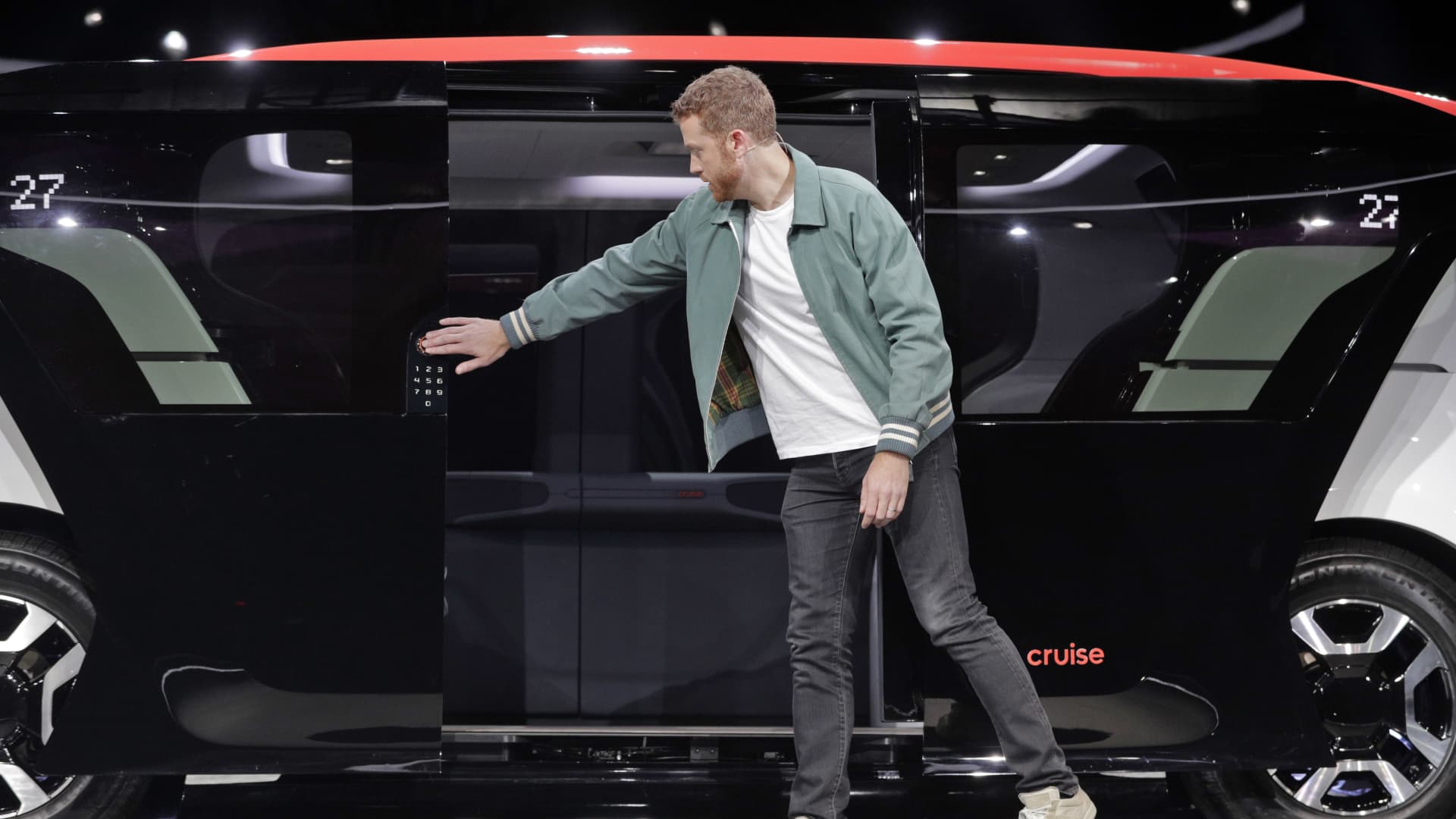 Cruise co-founder Kyle Vogt shows off the push-button opening of the laterally opening doors on the new Cruise Origin, a fully autonomous passenger vehicle, in San Francisco, Jan. 21, 2020.