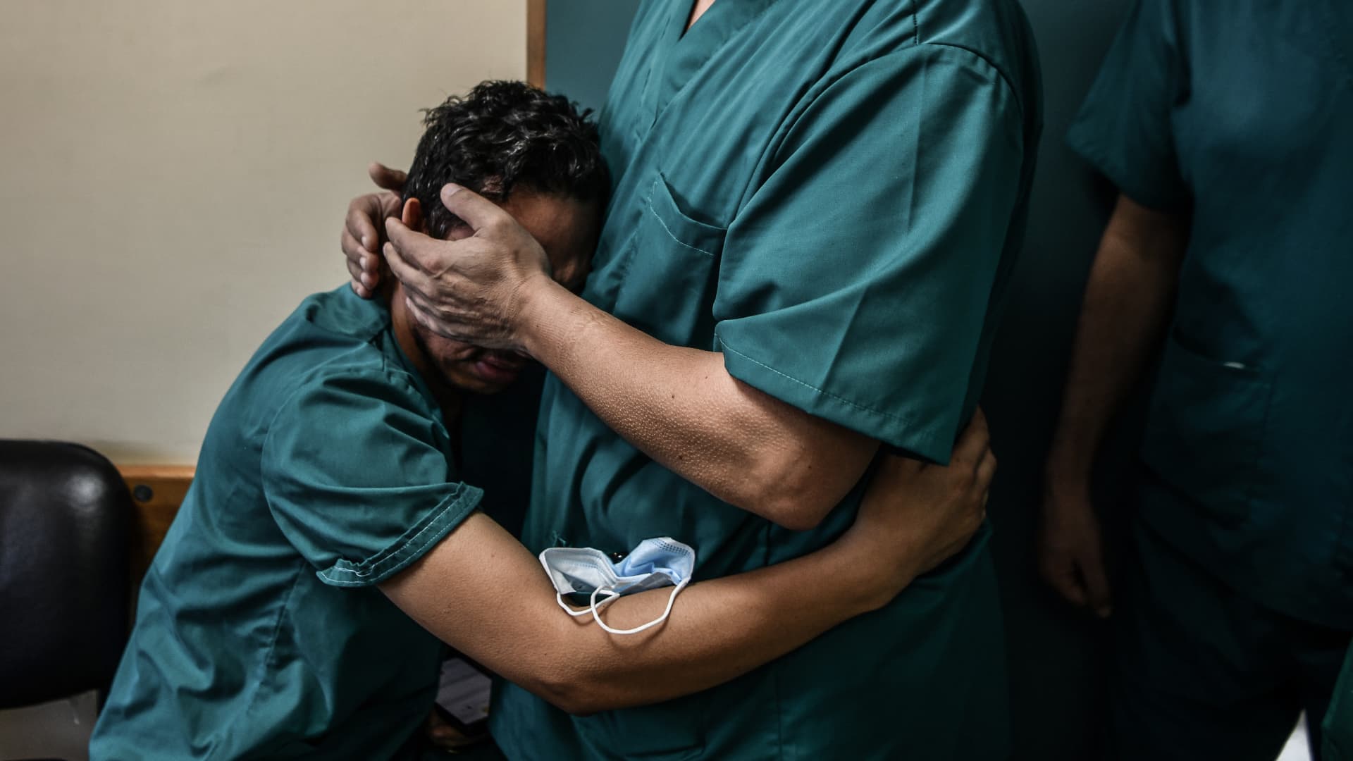 A Palestinian nurse, working at Nasser Hospital, mourns after he receives news that his brother had been killed in the aftermath of Israeli attacks in Khan Younis, Gaza on November 09, 2023.