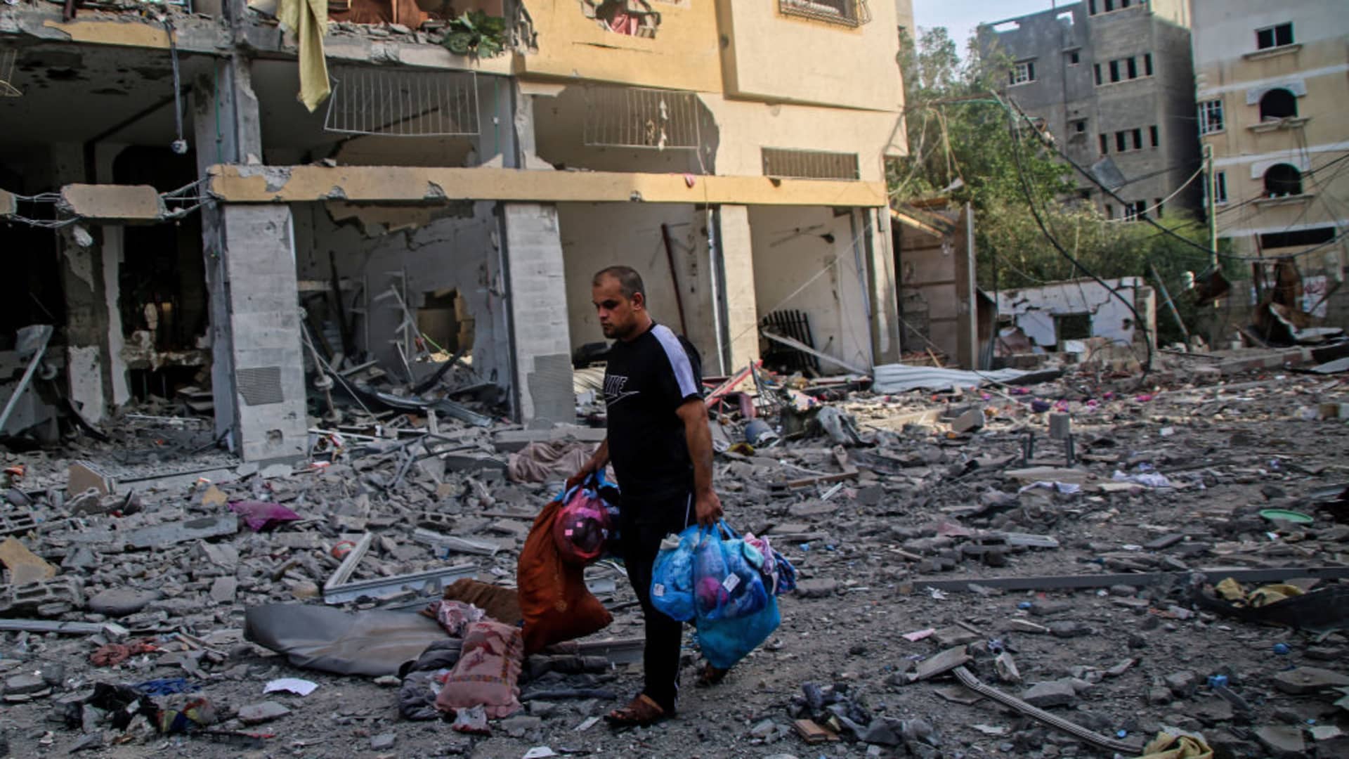 Palestinian citizens inspect damage to their homes caused by Israeli airstrikes in the Karama area, northern Gaza Strip October 11, 2023 in Gaza City, Gaza.