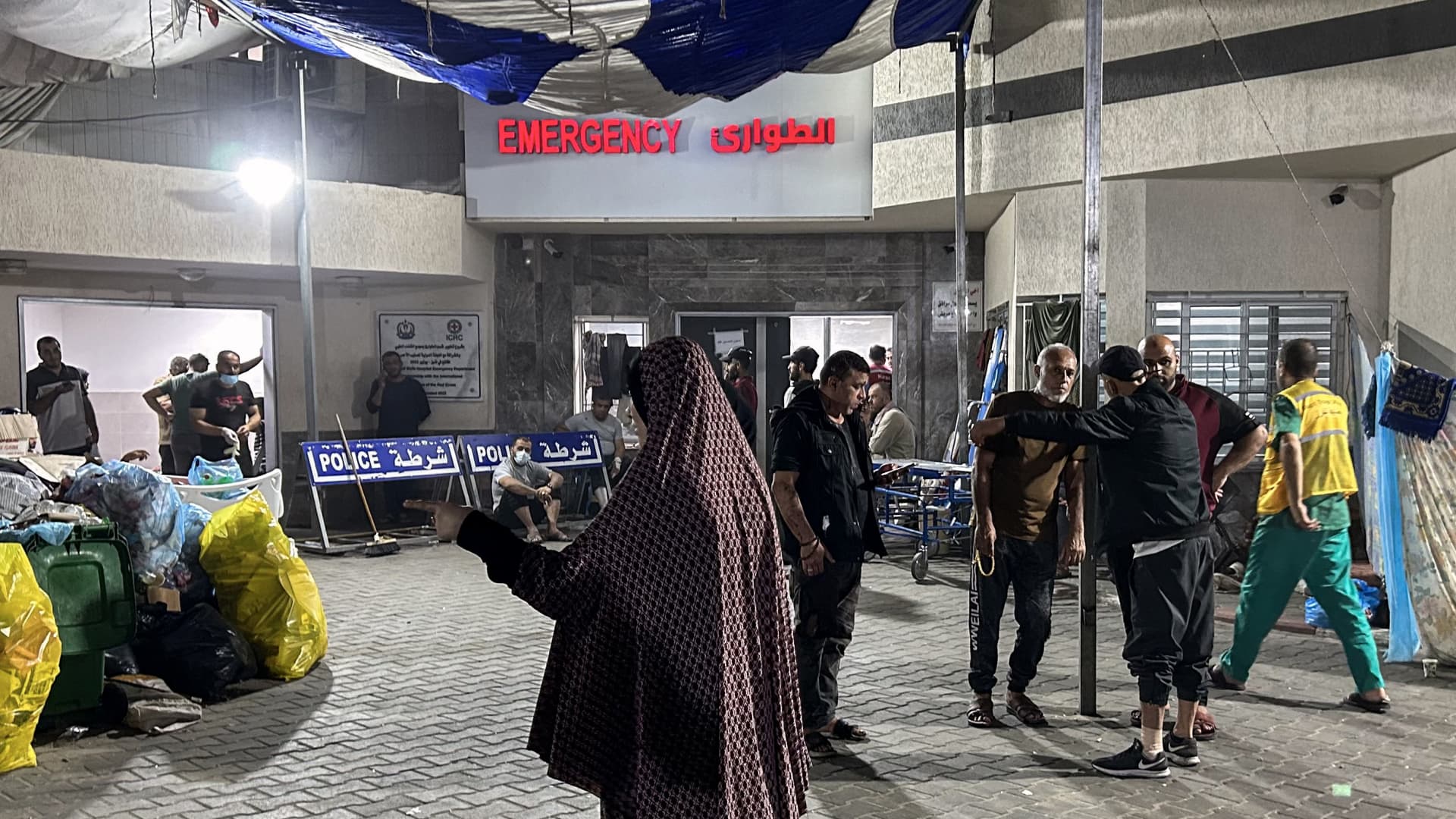 People stand outside the emergency ward of Al-Shifa hospital in Gaza City on Nov. 10, 2023, amid ongoing battles between Israel and the Palestinian Hamas movement.