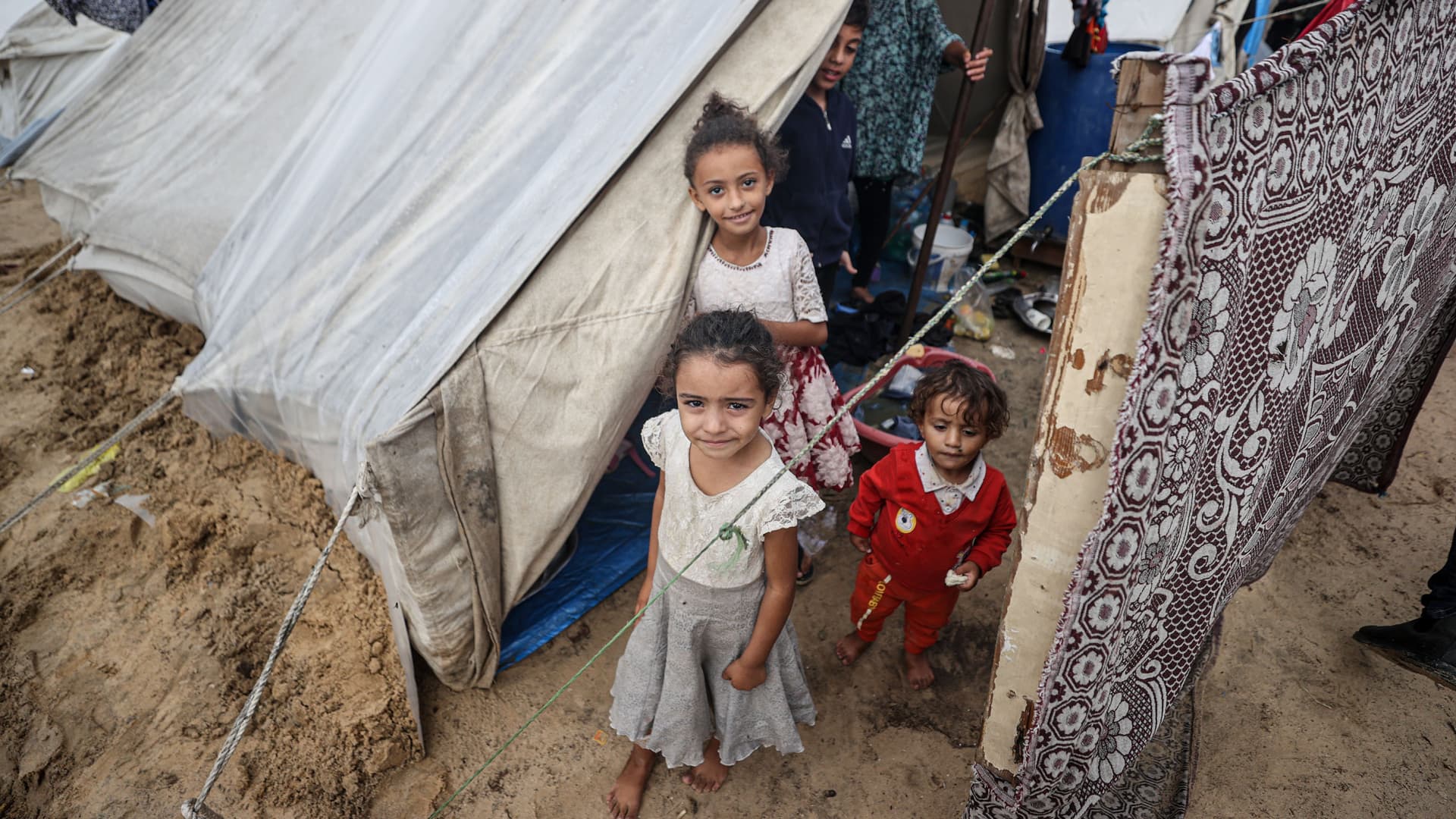 Children are seen in the United Nations Relief and Works Agency (UNRWA) refugee camp located in Khan Younis, Gaza where displaced Palestinian families take shelter as Israeli attacks on Gaza continue on November 15, 2023. 