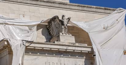 Watchdog report is critical of former Fed officials in stock trading controversy