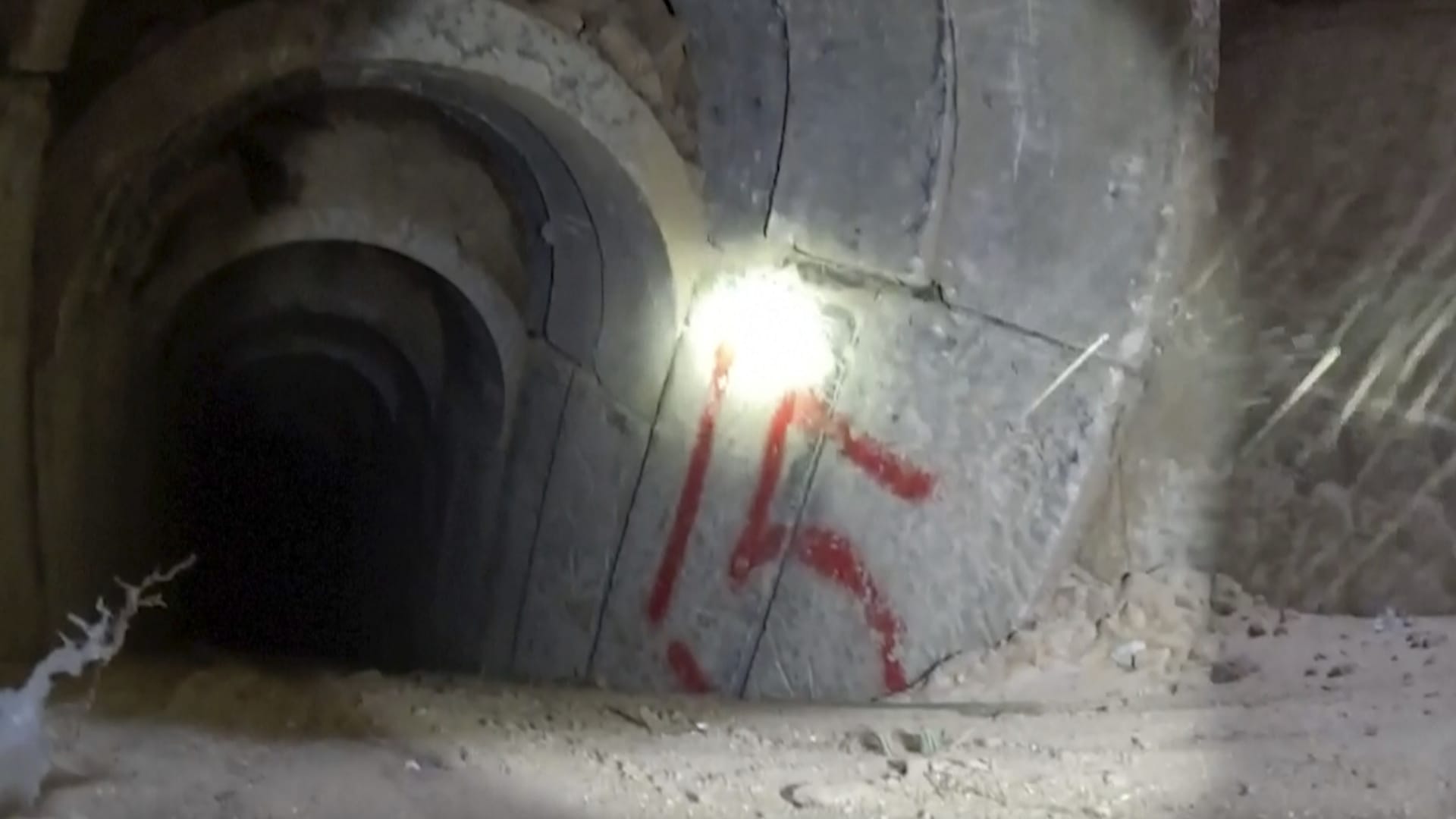 This image made from video released by the Israeli military shows bodycam footage from inside a tunnel. Israeli Defense Forces released footage on Wednesday, Nov. 8, 2023 of what they say are combat engineers locating, exposing and detonating Hamas's tunnel shafts in the Gaza Strip.
