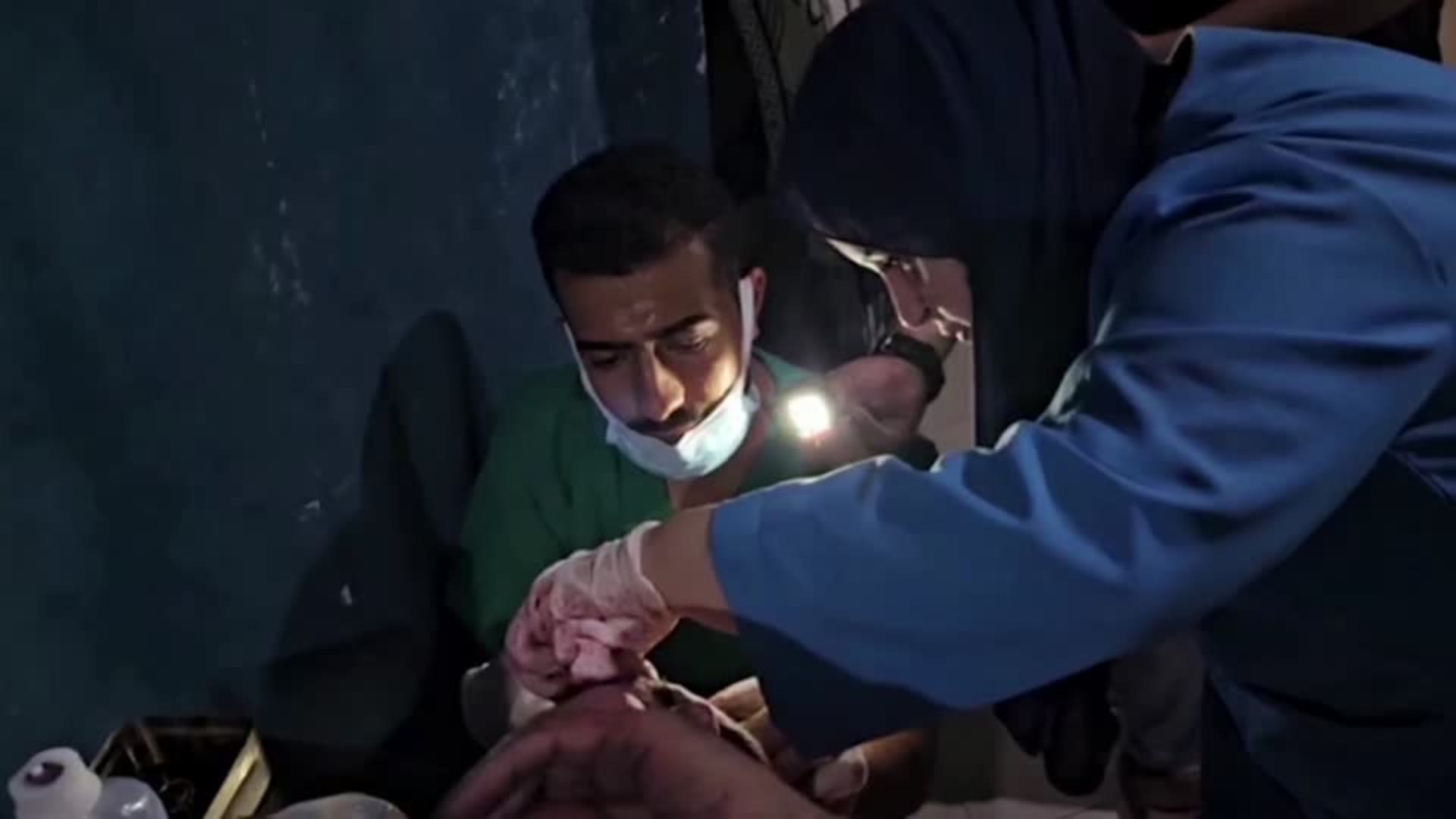 Medical team in Gaza's Indonesian hospital use flashlights amid power cut