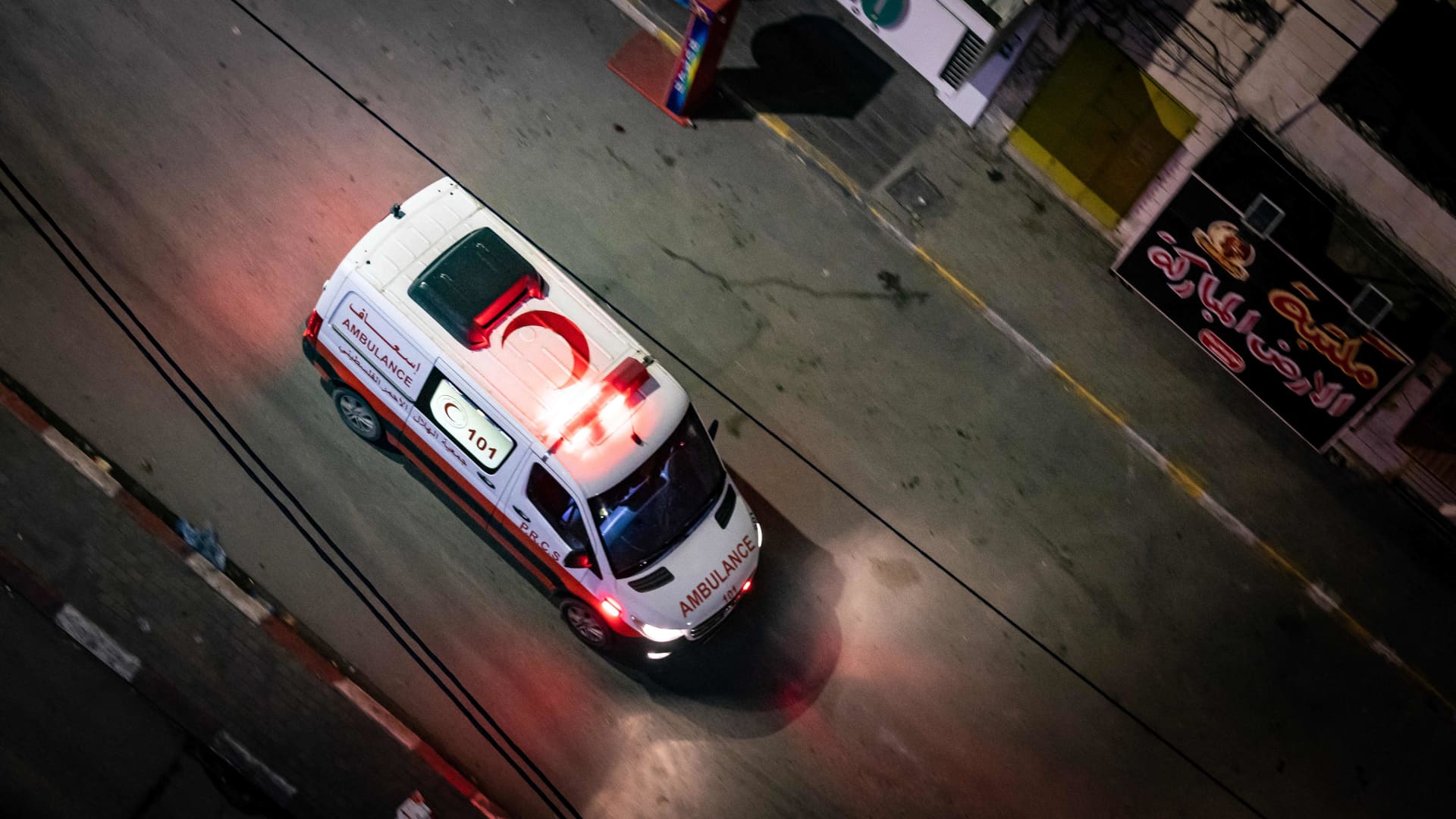 An ambulance arrives during a raid by the Israeli army in the occupied West Bank Jenin refugee camp overnight on November 16, 2023.