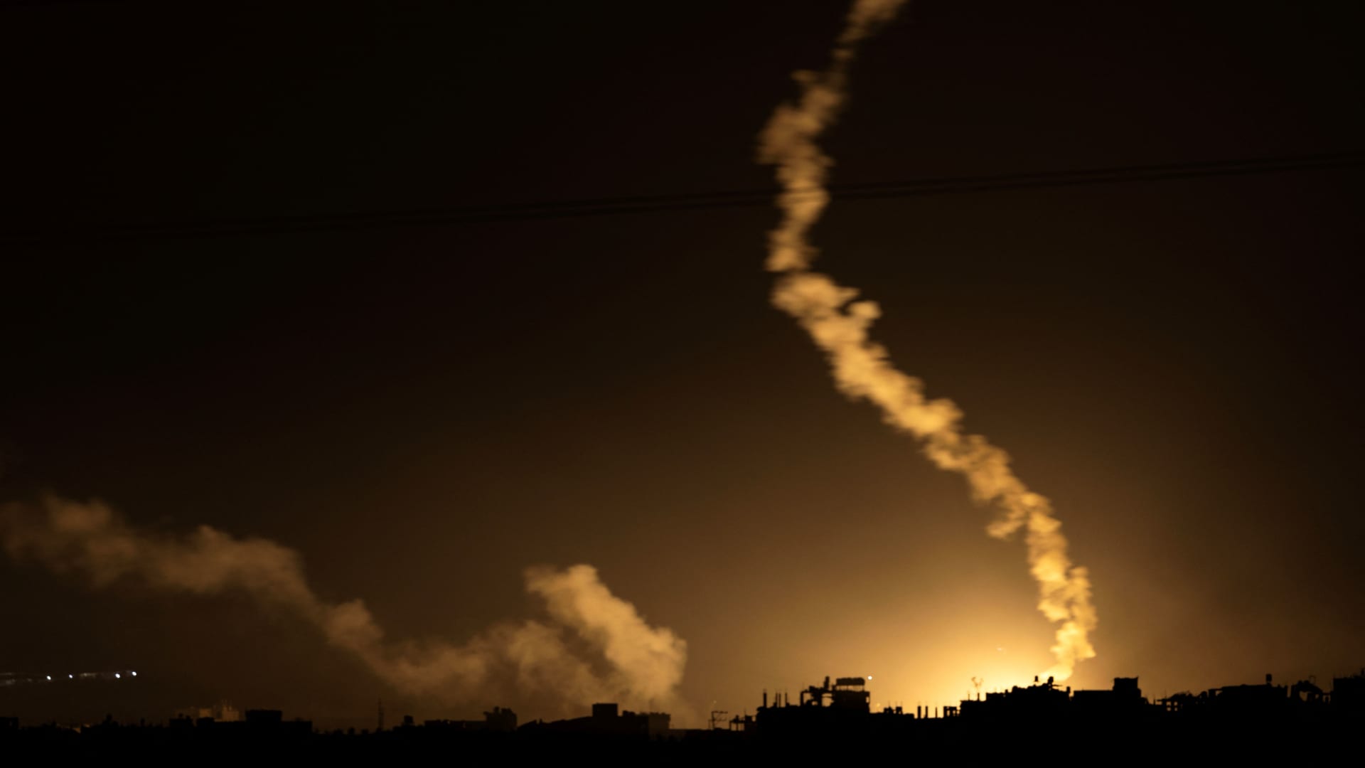 This picture taken from a position along the border with the Gaza Strip in southern Israel shows flares launched by Israeli forces above the Gaza Strip amid ongoing battles with the militant group Hamas, on Nov. 17, 2023.