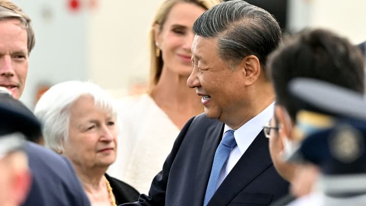 US Treasury Secretary Janet Yellen (L) looks on as Chinese President Xi Jinping (C) arrives at San Francisco International airport to attend the Asia-Pacific Economic Cooperation (APEC) leaders' week in San Francisco, California, on November 14, 2023.