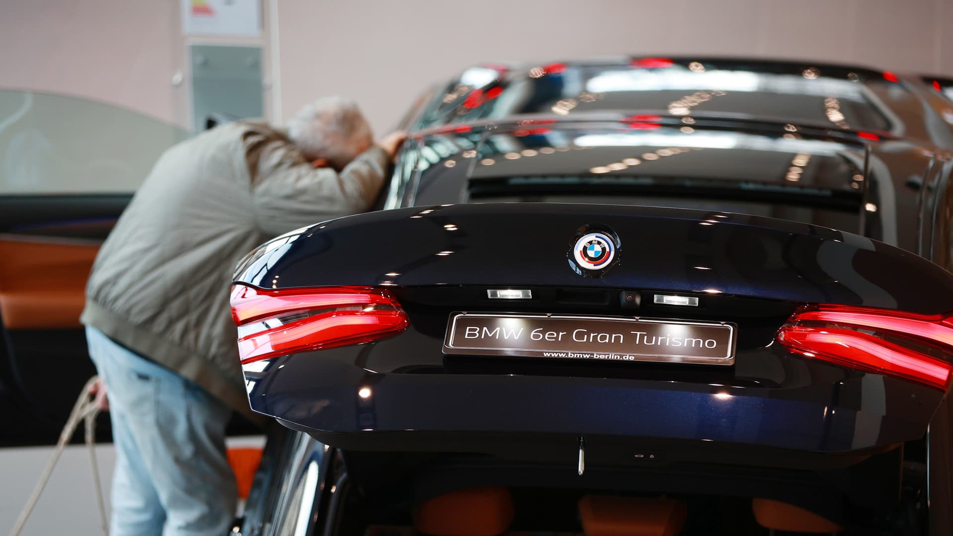A customer inspects the interior of a BMW 6 Series Gran Turismo automobile at a BMW AG showroom in Berlin, Germany, on March 14, 2023.
