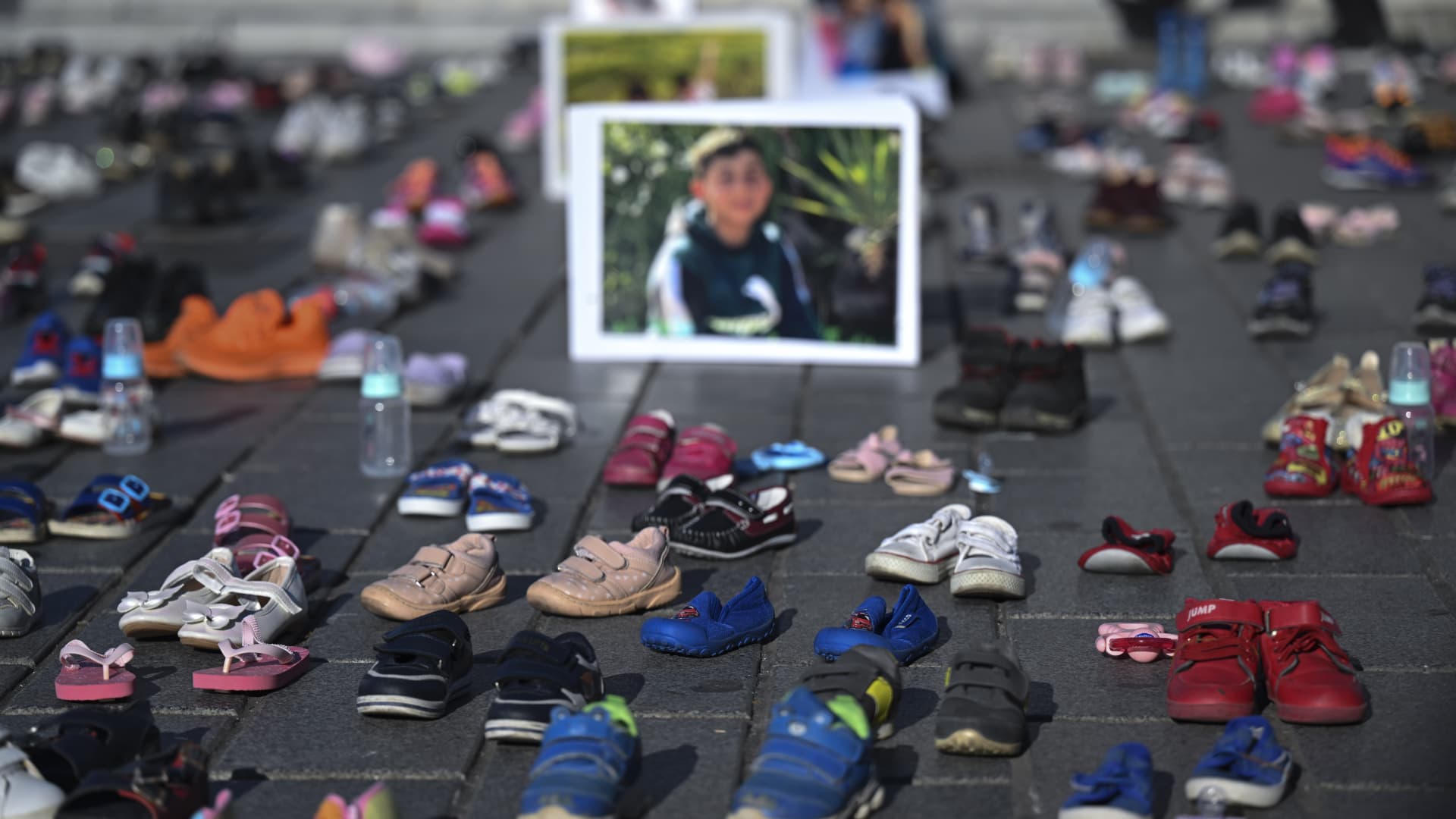 A view of the shoes and pictures of children left in Uskudar Square within a protest held in support of Palestinians and to draw attention to the children who lost their lives in Israeli attacks on Gaza in Istanbul, Turkey on November 21, 2023.