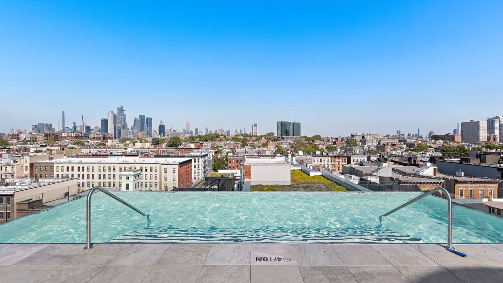 The rooftop pool has amazing views of different parts of New York City and New Jersey.