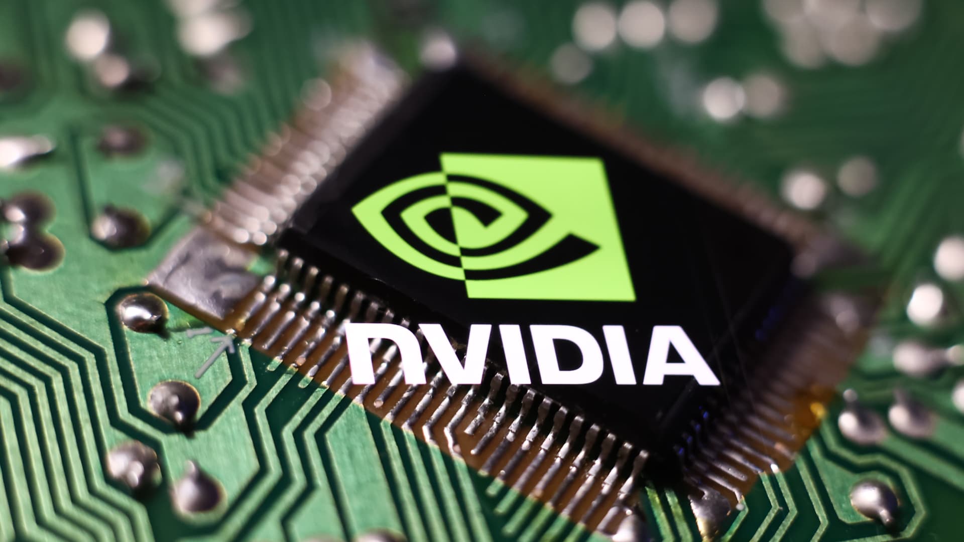 A microchip and the Nvidia logo are displayed on a phone screen in this photo taken in Krakow, Poland, on April 10, 2023.