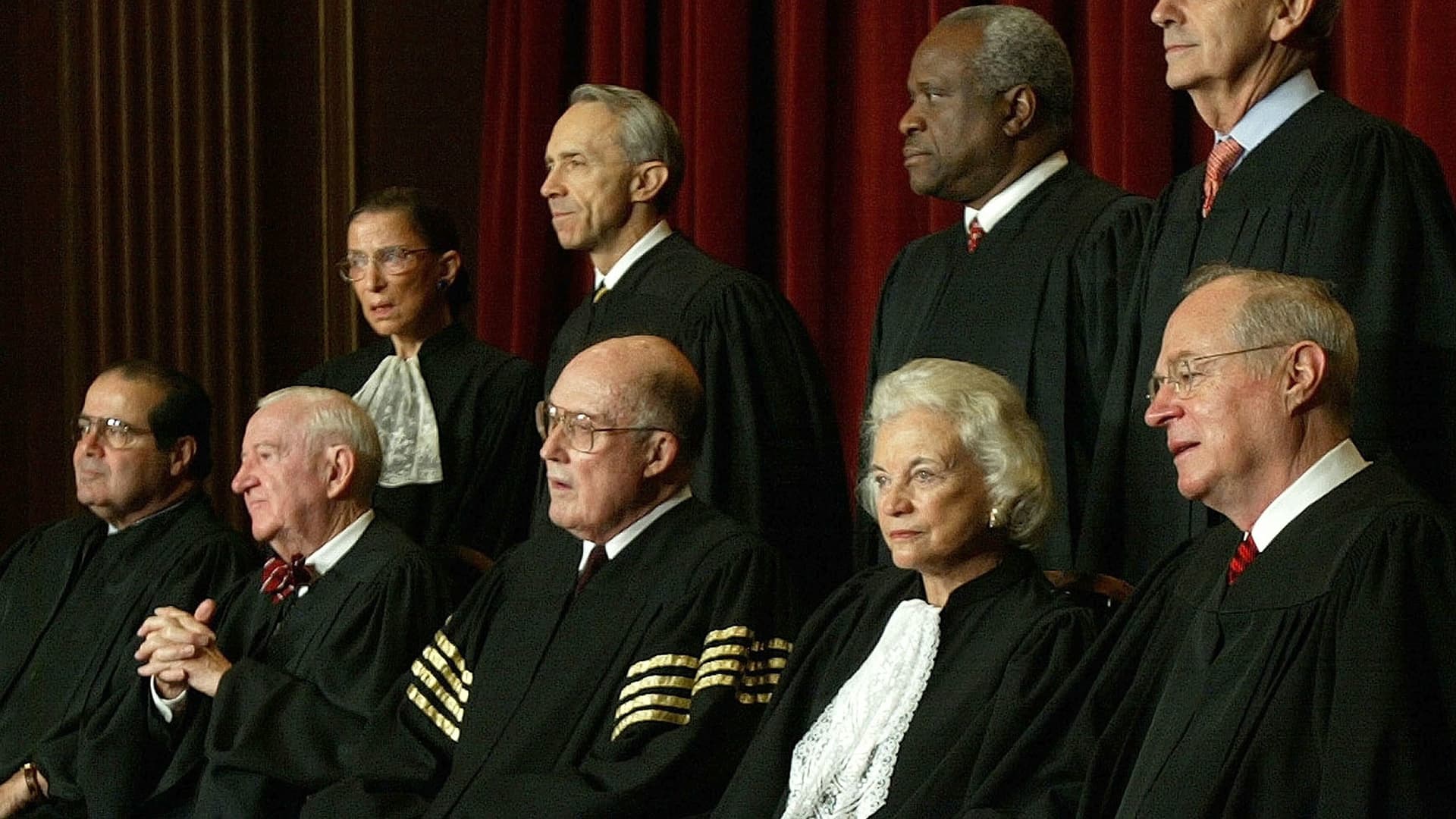 US Supreme Court Justices (L-R, Seated) Associate Justice Antonin Scalia, Associate Justice John Paul Stevens, Chief Justice William H. Rehnquist, Associate Justice Sandra Day O'Connor, Associate Justice Anthony M. Kennedy, (L-R, Standing) Associate Justice Ruth Bader Ginsburg, Associate Justice David H. Souter, Associate Justice Clarence Thomas and Stephen G. Breyer pose for pictures at the US Supreme Court December 5, 2003 in Washington, DC.